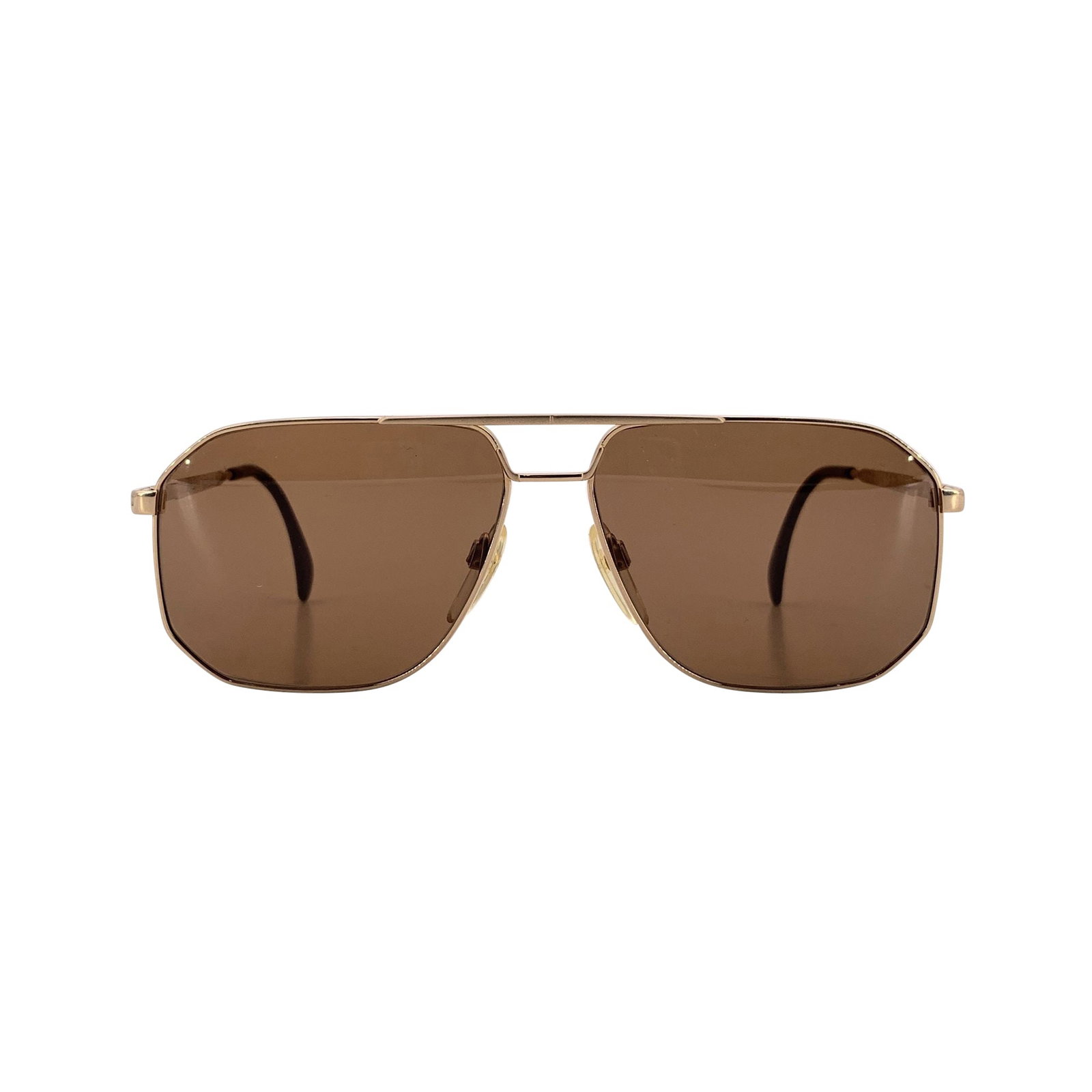 Silhouette Vintage Metal Sunglasses: These Silhouette Aviator Vintage Sunglasses embody the clean precision and effortless elegance that defined Austrian design in the 1980s. With their gold-tone metal frame, they reflect a refined minim