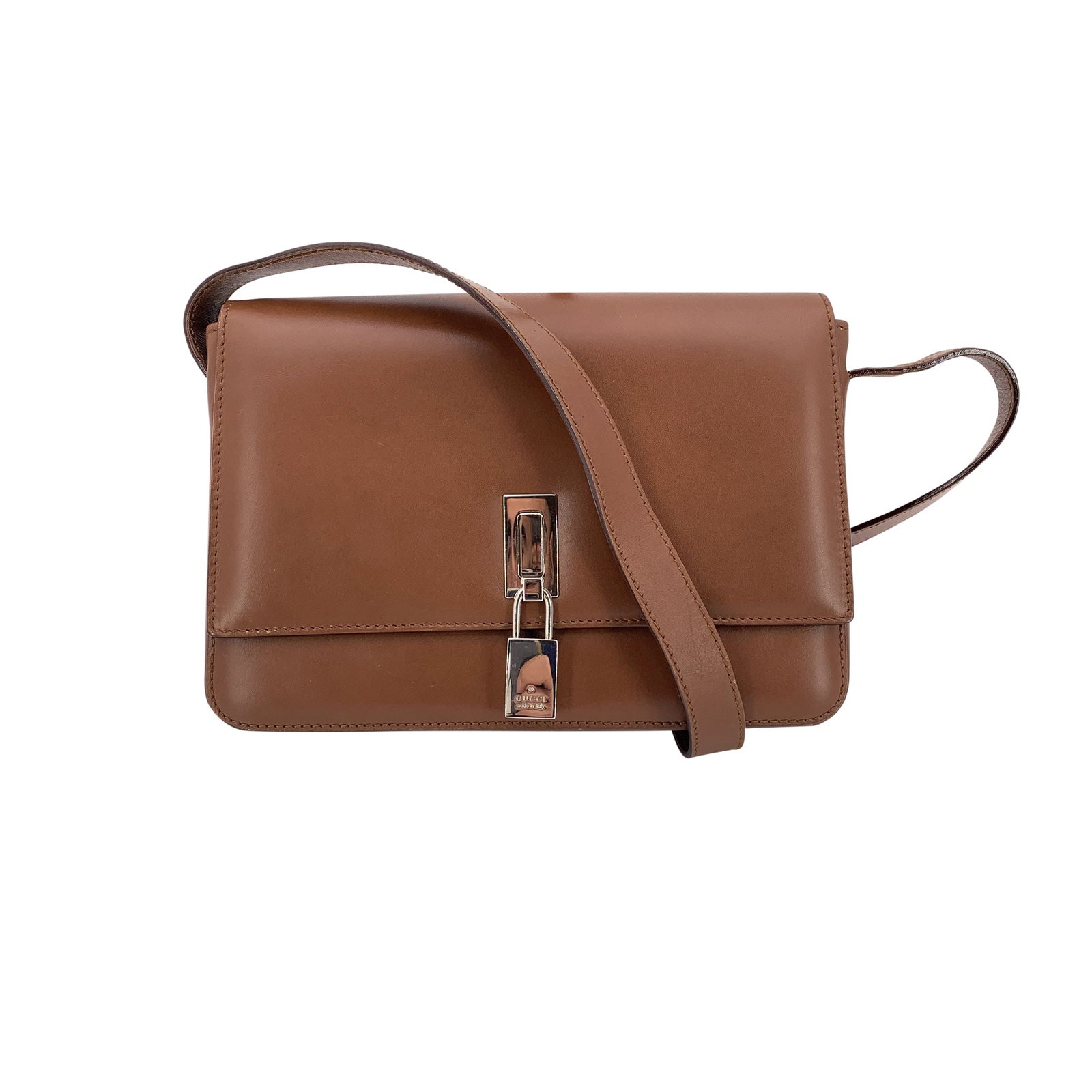 Gucci Leather Shoulder Bag: Timeless and refined, this Gucci Box Shoulder Bag captures the elegance and structure of Gucci's classic design era. Crafted in smooth brown leather, it features a flap closure accented by a silver-to