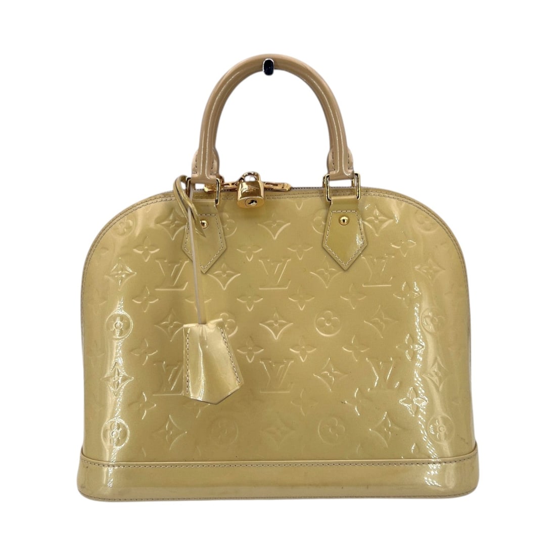 Louis Vuitton Patent leather Handbag Alma: The Louis Vuitton Alma is a true masterpiece of design, tracing its lineage back to a custom creation for Mademoiselle Coco. This medium-sized PM model, crafted in France between 2010 and 2019, radiat