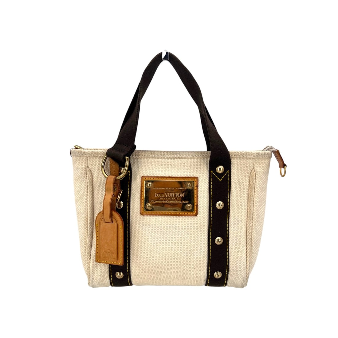 Louis Vuitton Cloth Handbag Antigua: Embrace a piece of Louis Vuitton history with this charming Antigua PM Tote Bag, a standout model from the 2000-2009 era. Named after the Caribbean island, the Antigua collection was the house's first