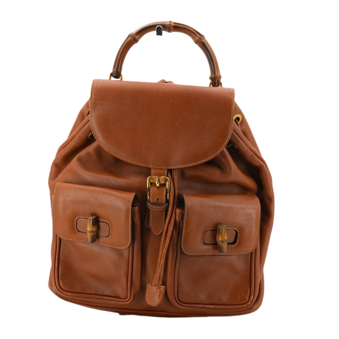 Gucci Vintage Leather Backpack Bamboo: Step into the timeless elegance of Italian craftsmanship with this Gucci Vintage Bamboo Backpack. A true icon of the 2010-2019 era, the Bamboo model is celebrated for its unique fusion of natural elem