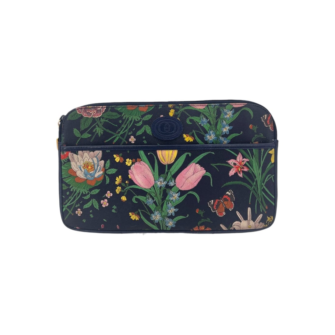 Gucci Vintage Cloth Clutch Bag Flora: Embrace the vibrant spirit of the 1980s with this exquisite Gucci Flora Zip Pochette Clutch, a quintessential piece for any vintage lover. Made in Italy between 1980 and 1989, this medium-sized clutch