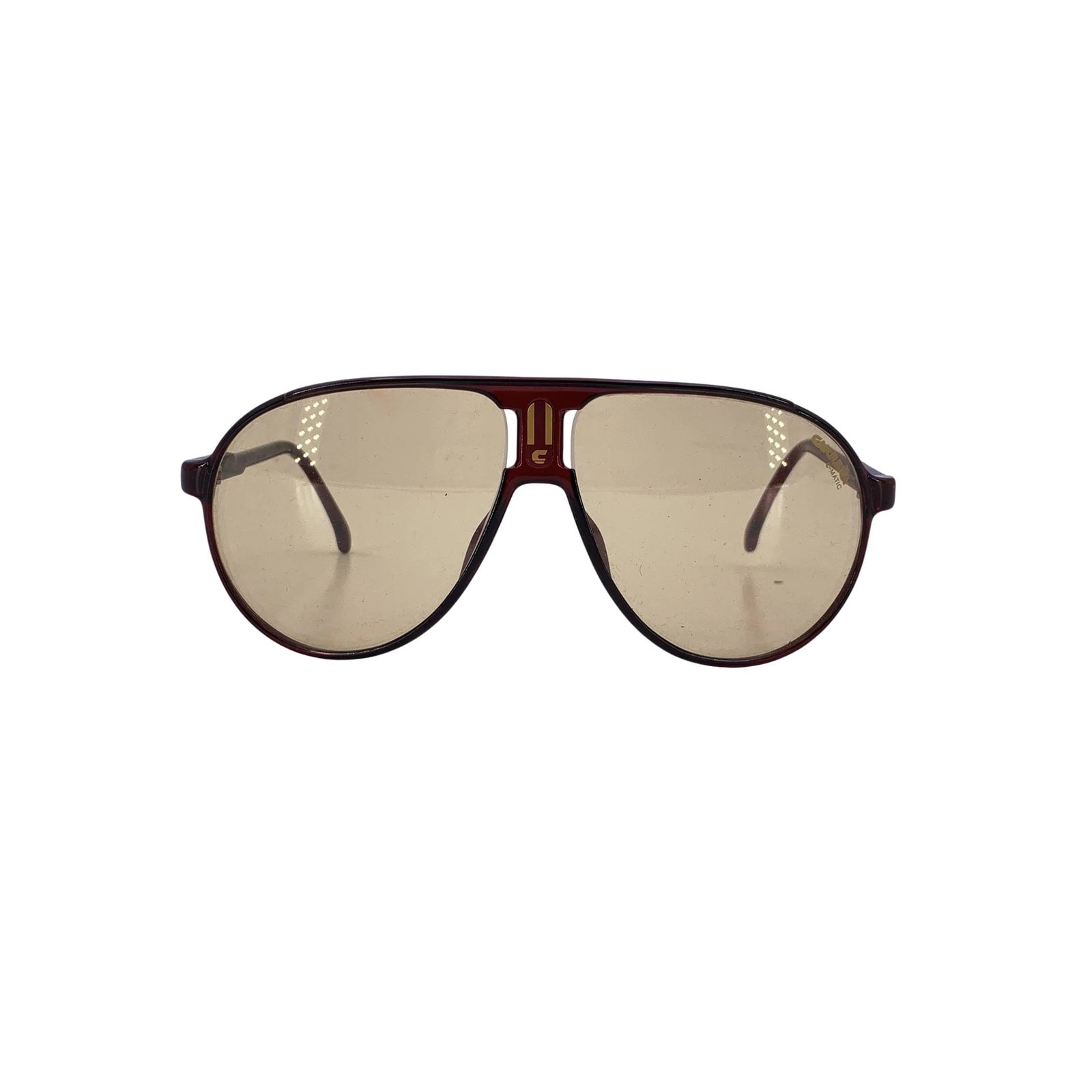 Carrera Vintage Plastic Sunglasses CMatic: Embrace the bold aesthetics of the 1980s with these Carrera Vintage Aviator CMatic sunglasses. Expertly crafted in Germany between 1980 and 1989, this pair features a durable brown plastic frame that 