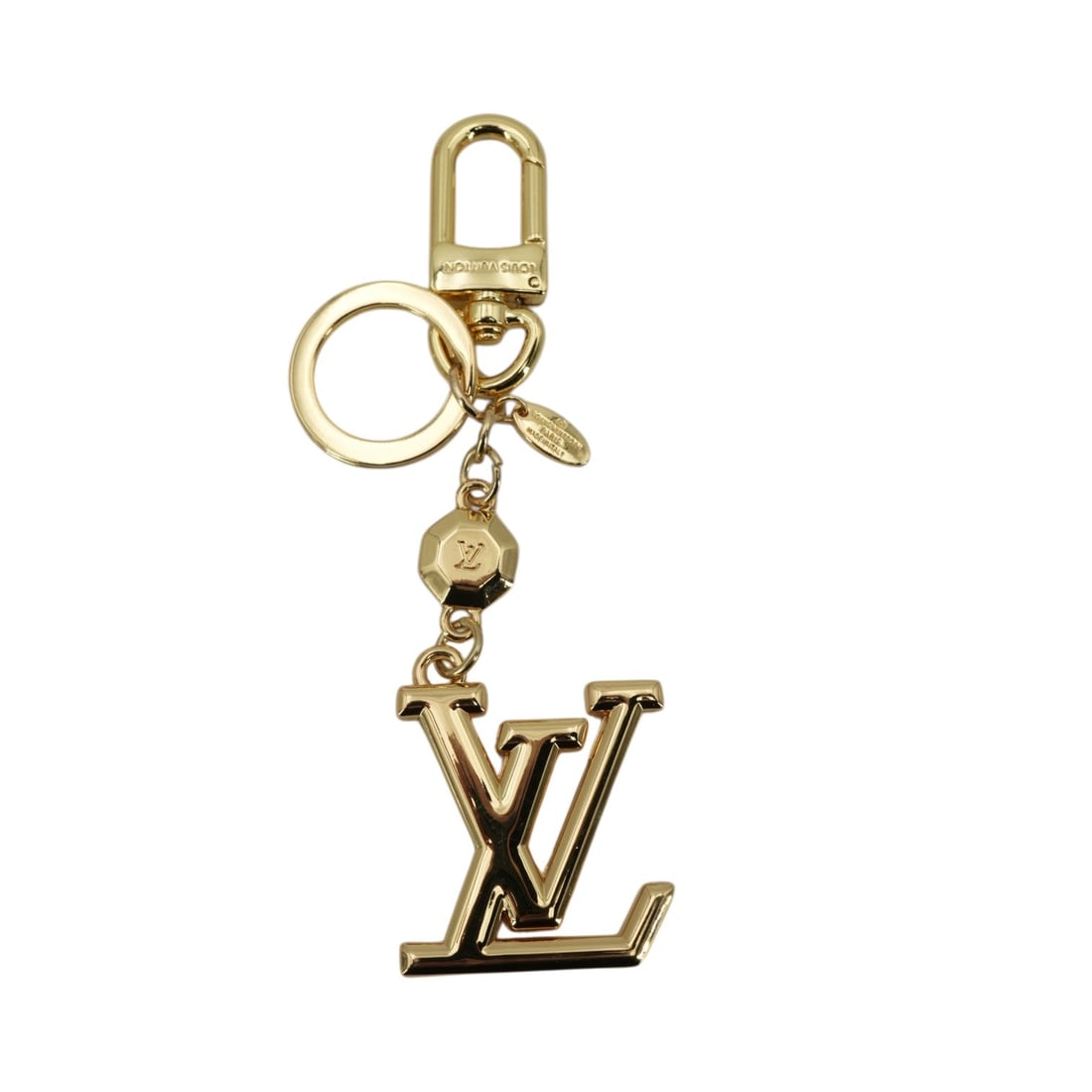 Louis Vuitton Other Accessory Lv Faccettes: Add a touch of contemporary Parisian elegance to your collection with the Louis Vuitton Lv Faccettes Gold Metal Charm Keyring (M65216). Crafted in France with a modern 2020-or-later manufacture date, 