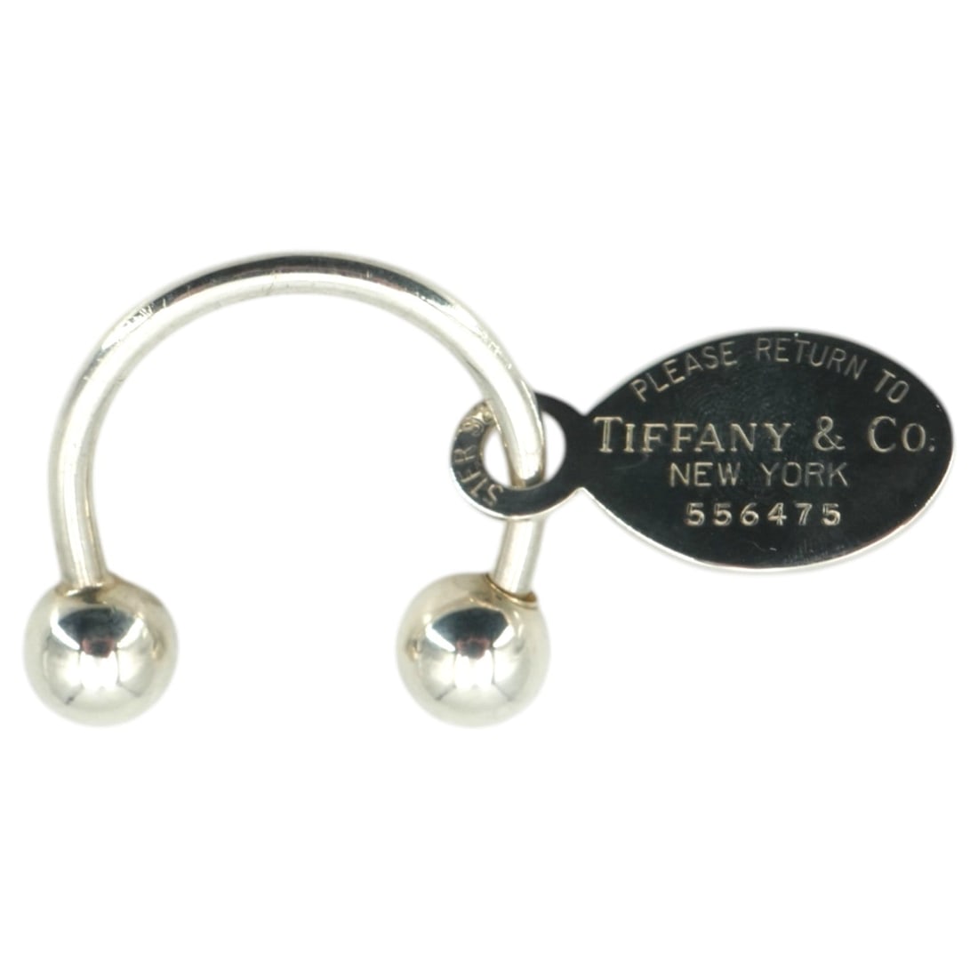 Tiffany & Co. Other Accessory Please return to: Discover the timeless charm of this Tiffany & Co. Sterling Silver Return to Oval Tag Screwball Keyring, a piece that beautifully blends utility with the brand's iconic heritage. This "Please Return to