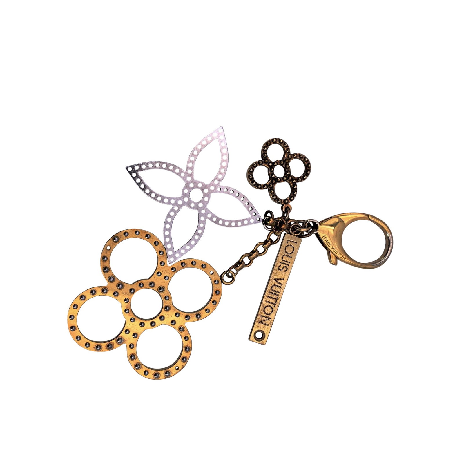 Louis Vuitton Metal Accessory: A stylish and playful bag charm key chain from the 2012 Bijoux Sac Tapage collection. Crafted in gold-plated metal with contrasting gold-tone and silver-tone elements, this accessory reflects Louis Vu