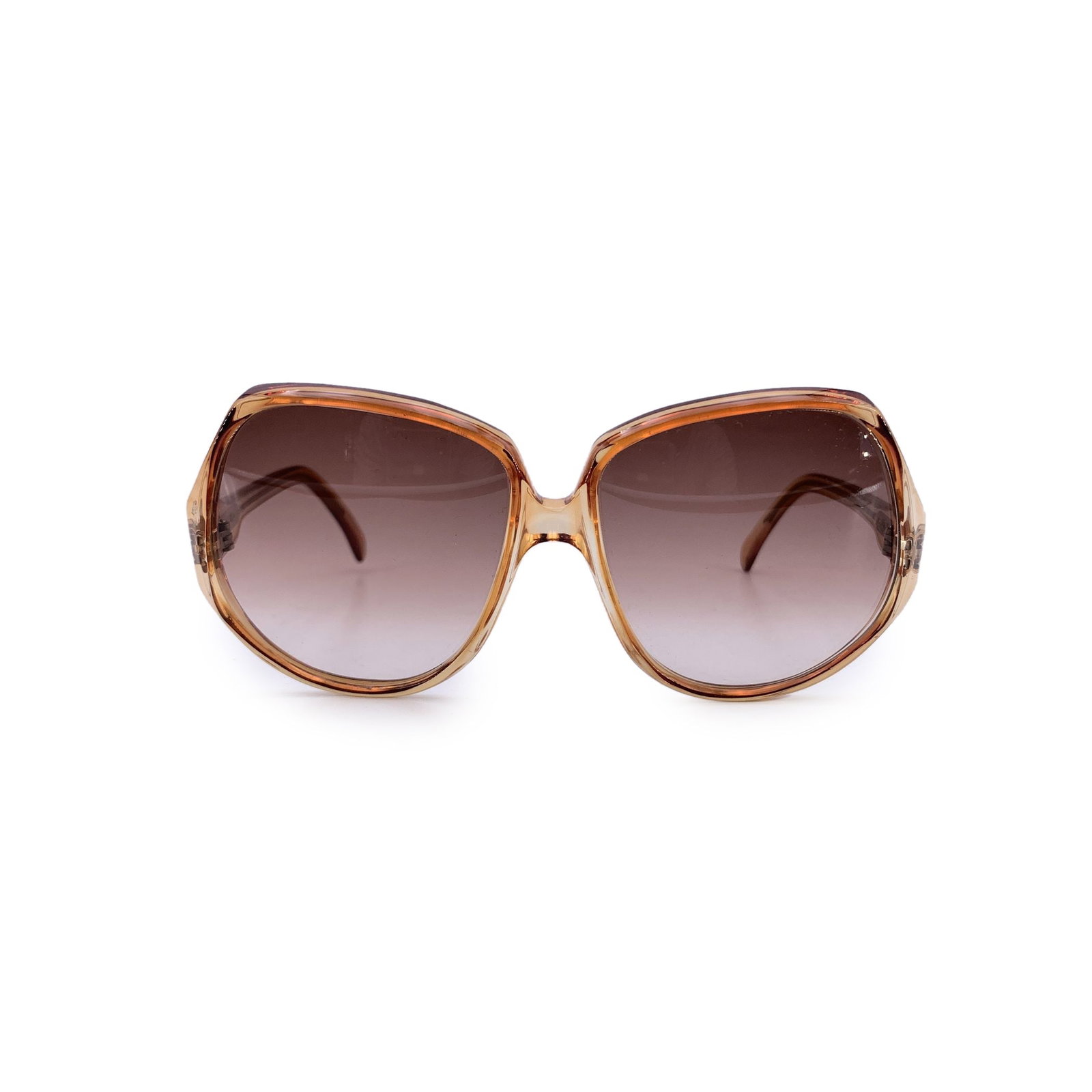 Yves Saint Laurent Vintage Plastic Sunglasses: A timeless piece from the golden era of designer eyewear, these vintage Yves Saint Laurent sunglasses, model Delias (52/18), offer understated elegance with a distinctly French touch. Made in France, 