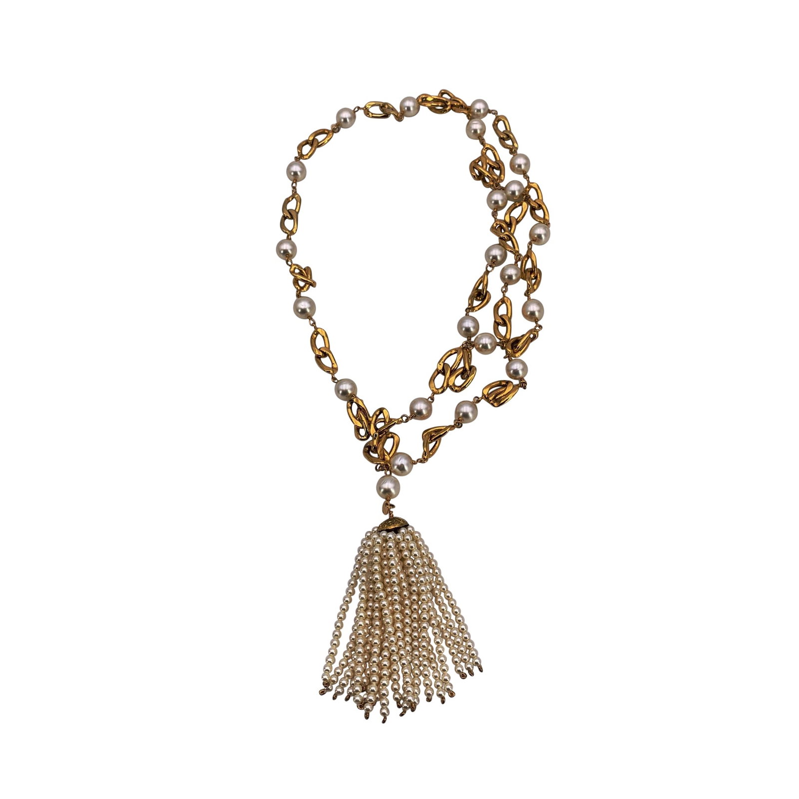 Chanel Vintage Pearl Necklace: This Chanel vintage tassel necklace or belt is a truly elegant piece that carries the brand's timeless glamour in every detail. Crafted with a gold-plated chain and accented with white faux pearls, it