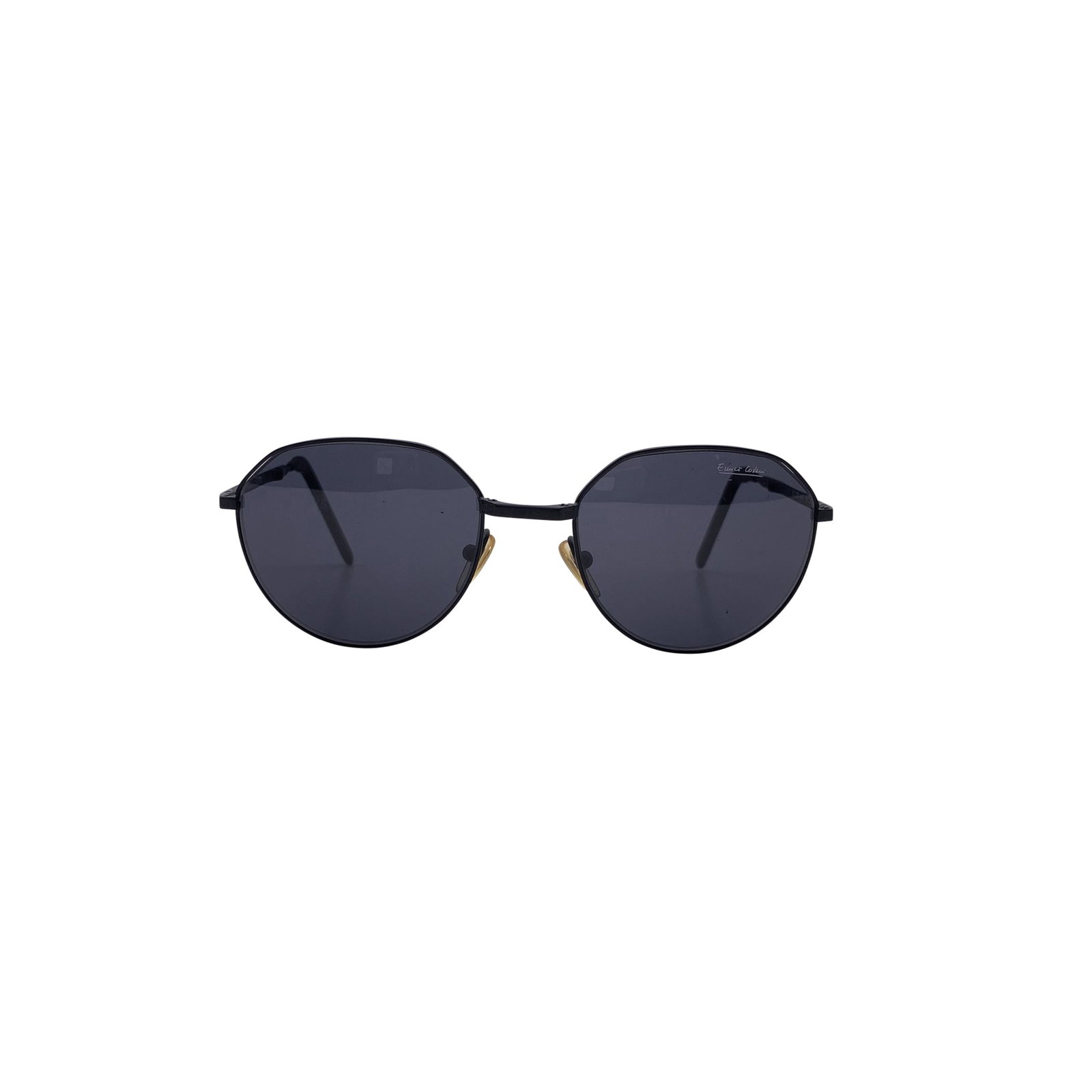 Enrico Coveri Vintage Metal Sunglasses: A sleek expression of Italian design from the 1980s, these Enrico Coveri vintage oval sunglasses capture the decade's love for innovation paired with understated elegance. Made in Italy between 1980 a