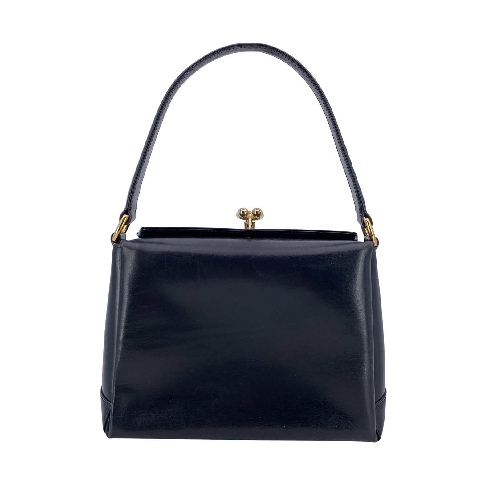 Gucci Vintage Leather Handbag: A true jewel from Gucci's golden age, this vintage navy blue leather top handle handbag tells a story of refined Italian craftsmanship and timeless elegance. Crafted in Italy between the 1980s and 198