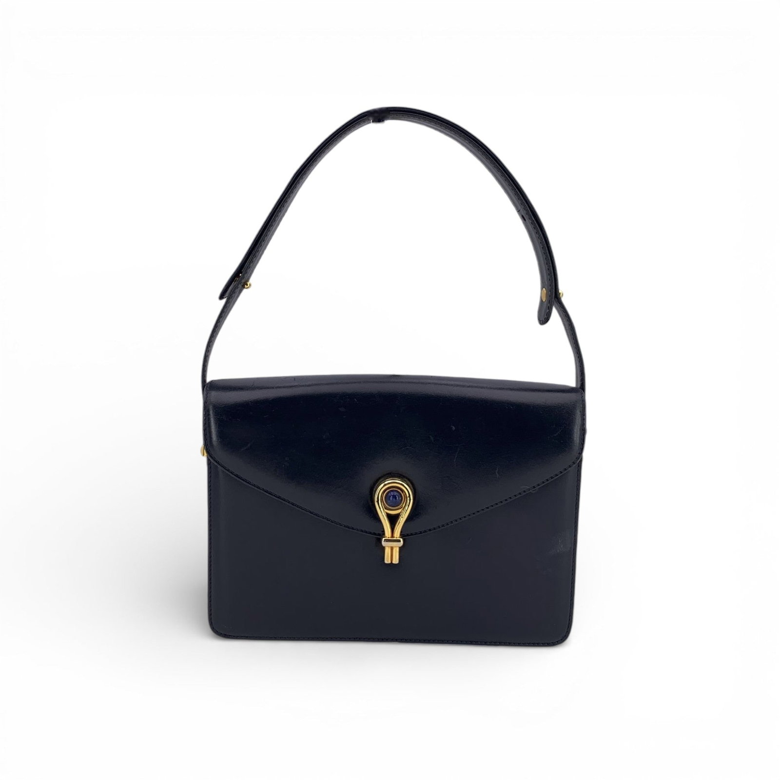 Gucci Vintage Leather Shoulder Bag: A truly exquisite find, this Vintage Gucci shoulder bag embodies the refined elegance and craftsmanship that define the House's heritage. Made from smooth blue leather, it features a striking flap clo