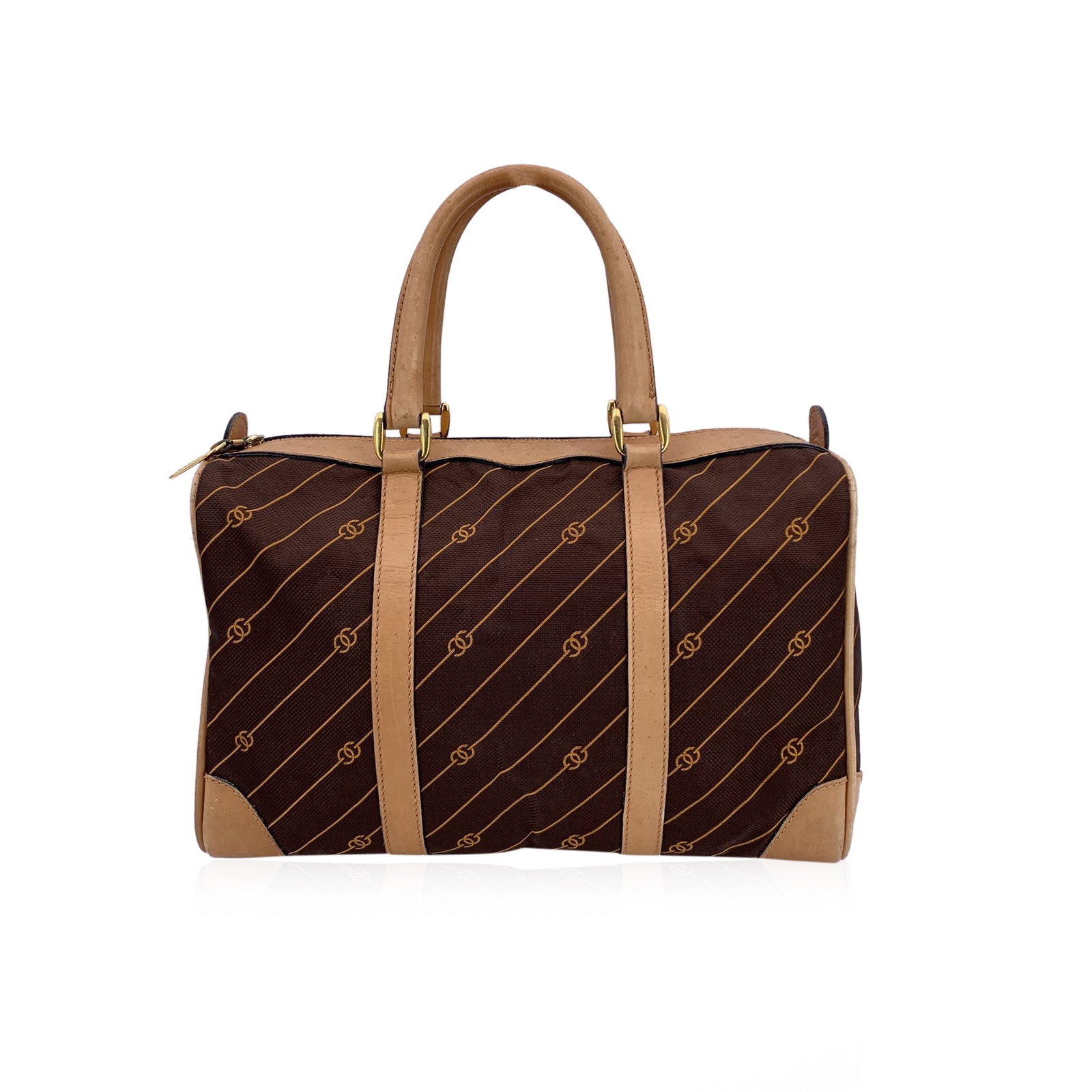 Gucci Vintage Cloth Handbag: Embrace a piece of vintage luxury with this Gucci Boston Bag, a timeless classic that perfectly blends iconic design with practicality. Crafted in rich brown canvas adorned with Gucci's signature stri