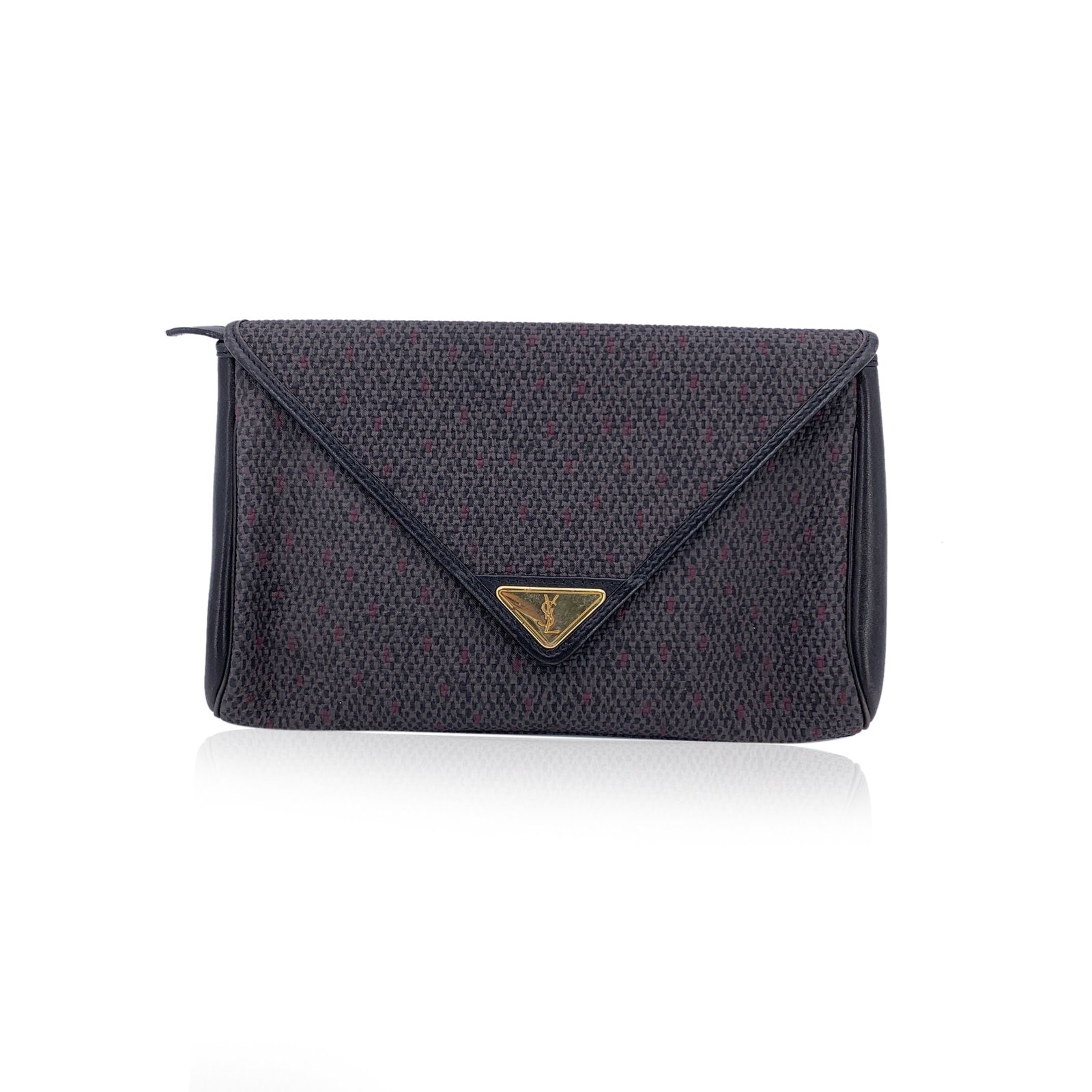 Yves Saint Laurent Vintage Plastic Clutch Bag: Chic and timeless, this vintage Yves Saint Laurent clutch is a refined statement of understated luxury. Crafted from grey textured vinyl canvas with black leather trim, it effortlessly balances classi