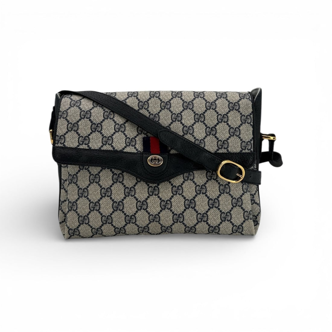 Gucci Vintage Cloth Shoulder Bag Monogram: Step back into the golden era of Italian craftsmanship with this stunning Gucci Vintage Blue Monogram Canvas Web Shoulder Bag. Dating from 1980-1989, this medium-sized treasure is a hallmark of the Gu
