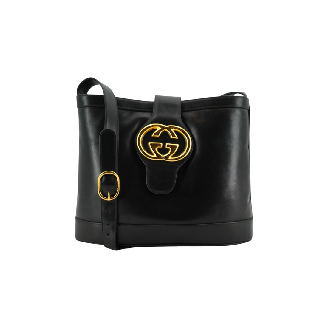 Gucci Vintage Leather Shoulder Bag Double G: Embrace the timeless sophistication of the 1970s with this exquisite Gucci vintage bucket shoulder bag. Expertly crafted in Italy, this medium-sized piece is made from premium black leather with a sle