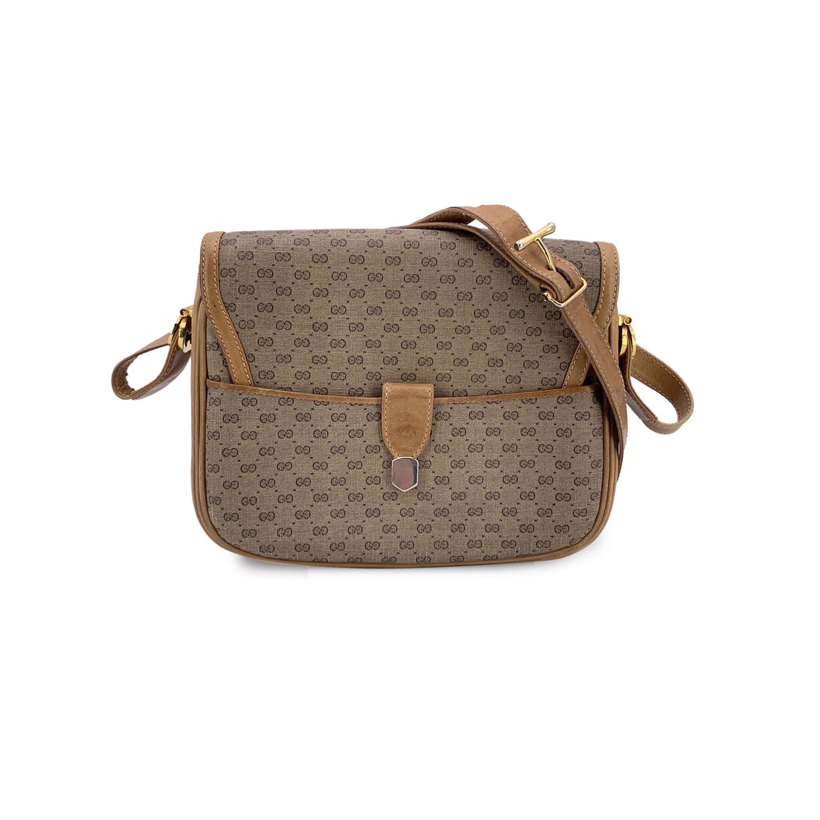 GUCCI VINTAGE CLOTH SHOULDER BAG MICRO GG: Step back into the golden era of 1970s Italian fashion with this exquisite Gucci Vintage Flap Shoulder Bag. A treasure for any vintage connoisseur, this medium-sized piece is crafted from classic beig