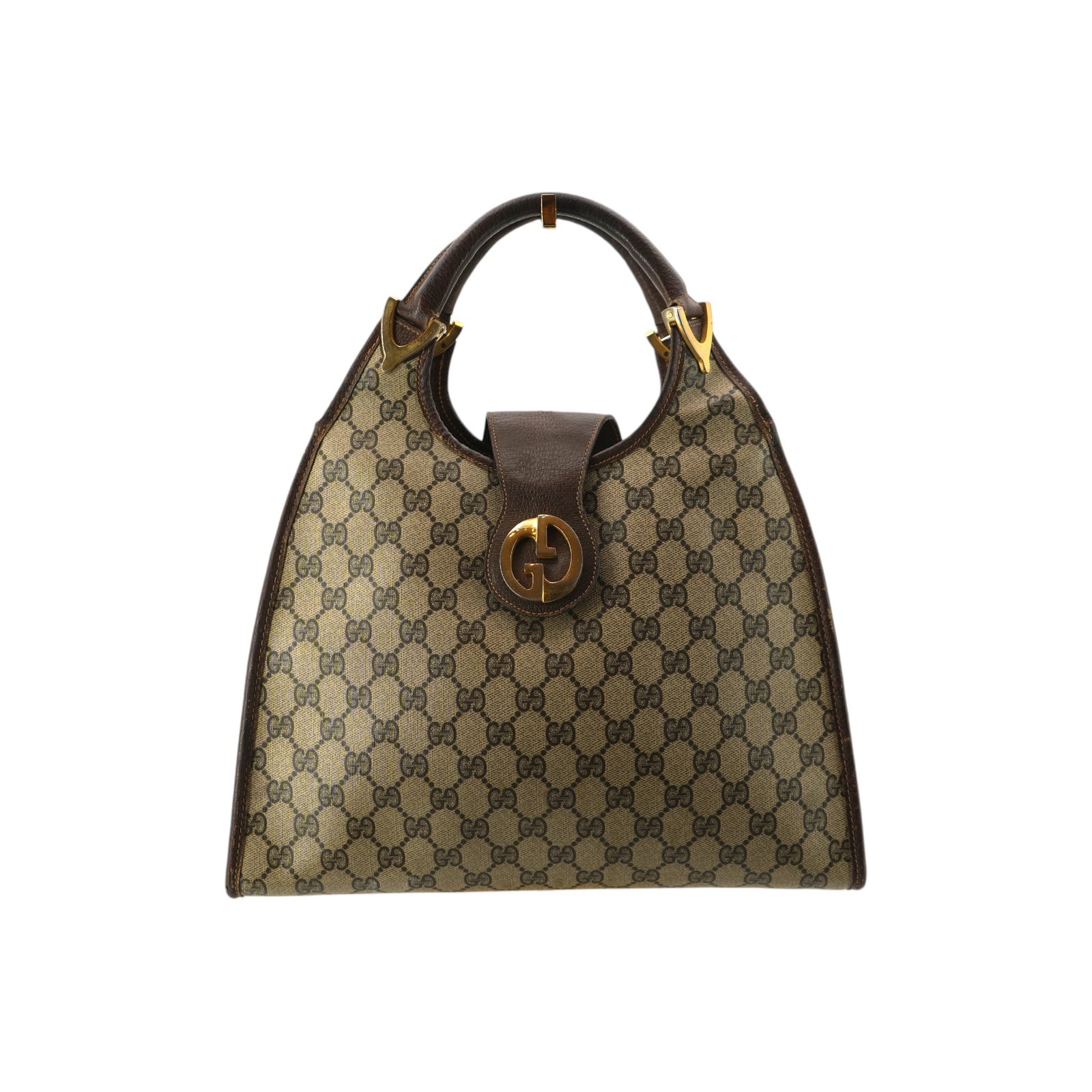 GUCCI VINTAGE CLOTH HOBOS STIRRUP: Embrace a piece of fashion history with this Gucci Stirrup Hobo Bag, a stunning representative of 1970s Italian craftsmanship. This medium-sized vintage treasure is crafted from classic brown monogram