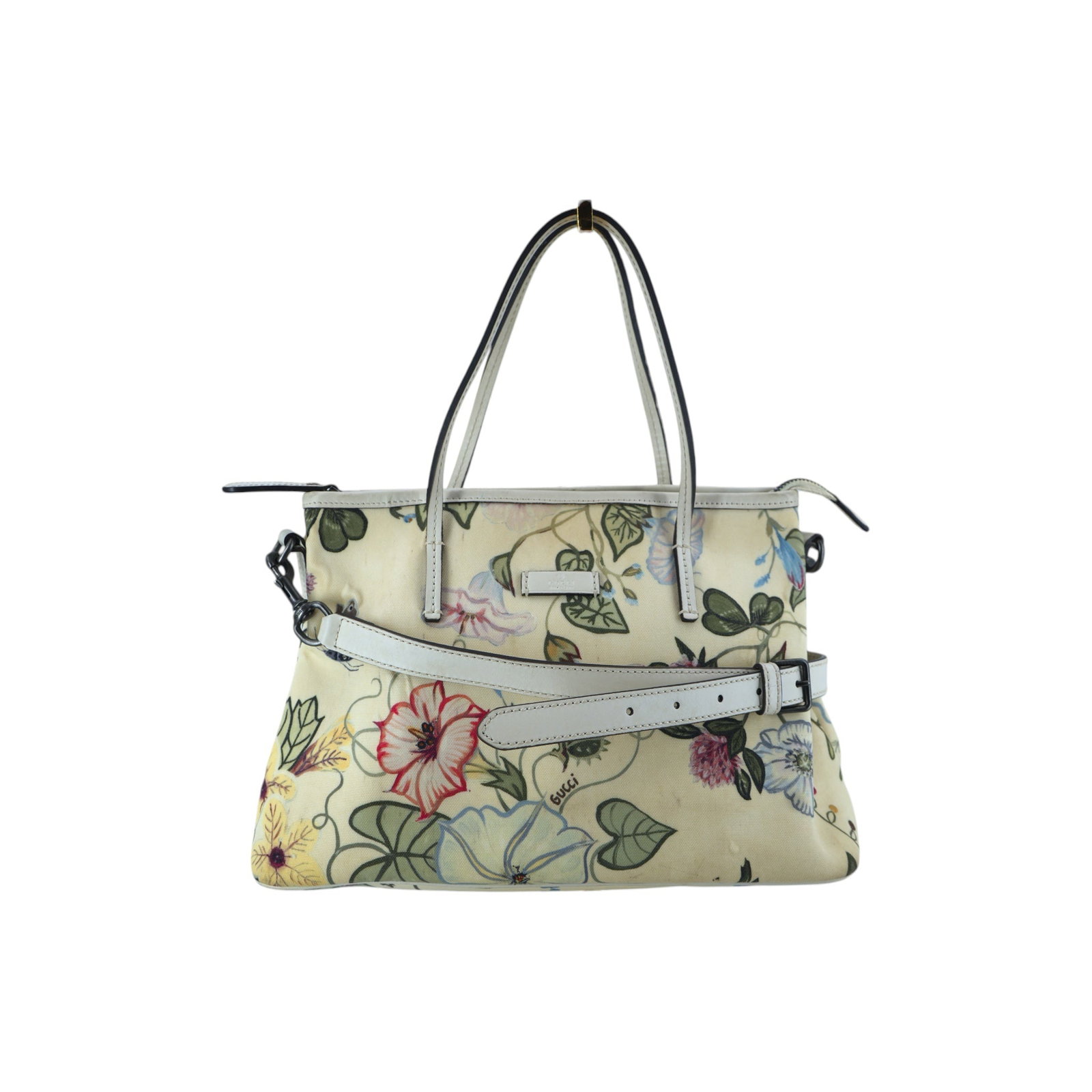 GUCCI CLOTH TOTE BAG FLORA: Embrace the romantic allure of a modern classic with this Gucci 2 Way Shoulder Tote Bag, a limited-edition masterpiece from the 2010-2019 era. This medium-sized tote features the legendary Flora print