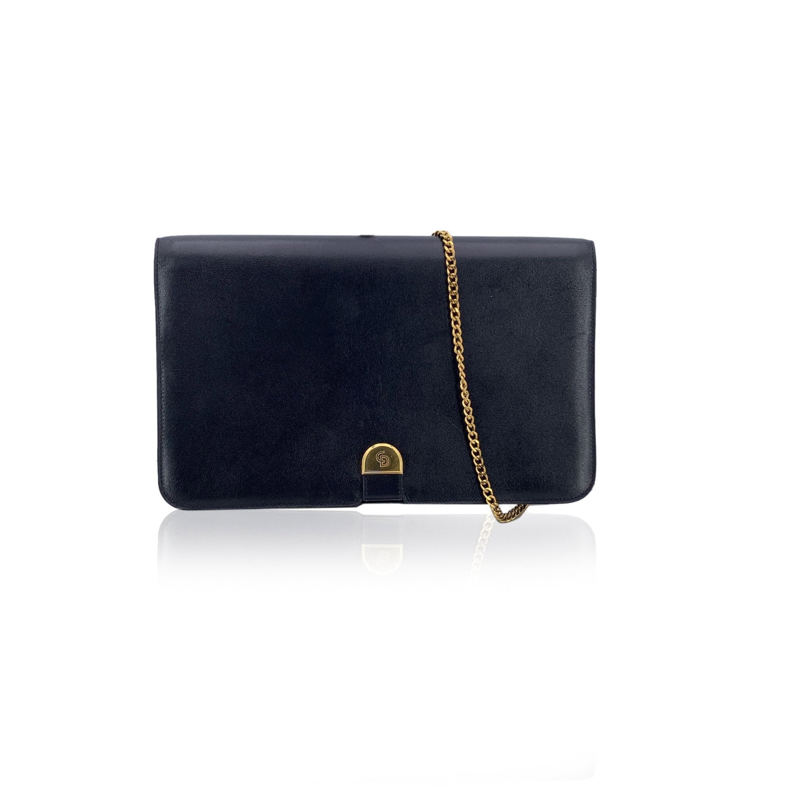 DIOR VINTAGE LEATHER SHOULDER BAG: Elegant and unmistakably classic, this vintage Christian Dior navy blue leather shoulder bag captures the quiet luxury of the House of Dior. Crafted in smooth navy leather with a structured silhouette