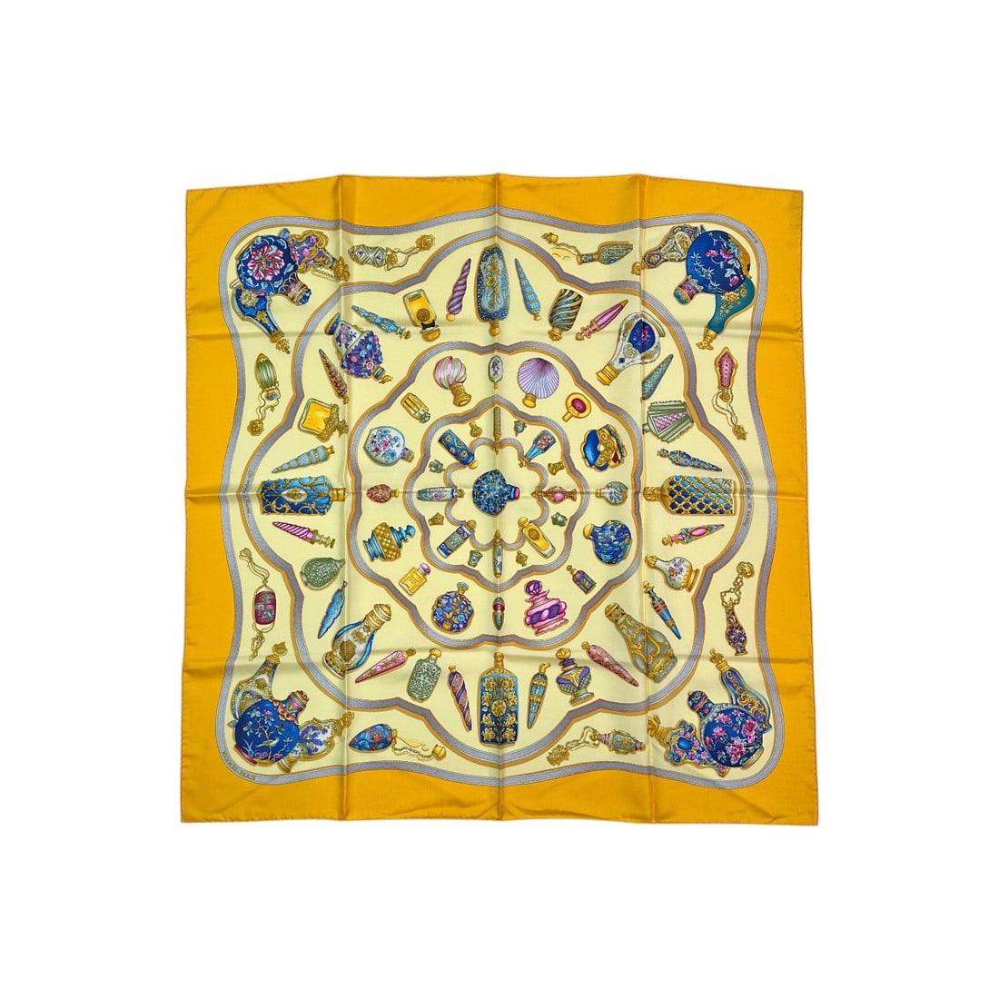 HERMES VINTAGE SILK SCARF CARRE 90: Step into the golden era of the 1980s with this exquisite Hermes "Qu'Importe le Flacon" silk scarf. A true masterpiece of French craftsmanship, this vibrant yellow Carre 90 was designed by the celebra