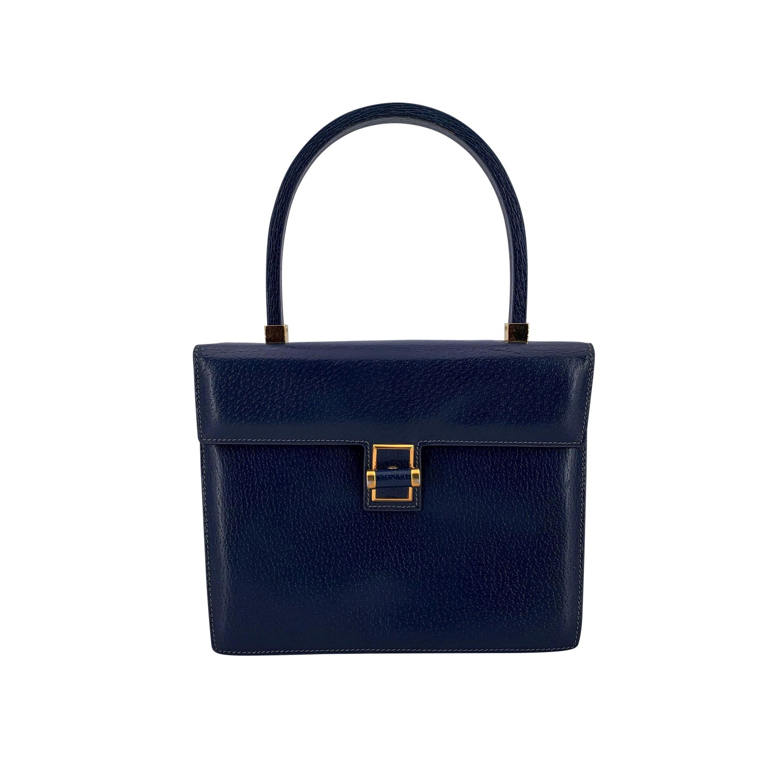 GUCCI VINTAGE LEATHER HANDBAG: Discover timeless sophistication with this Gucci Vintage Navy Blue Leather Top Handle Handbag from the 1980s. Crafted in Italy from rich, structured leather, this elegant medium-sized bag is designed 