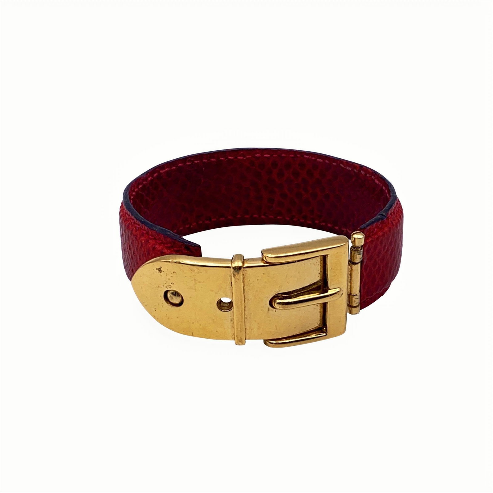 GUCCI VINTAGE LEATHER BRACELET: Vintage beautiful cuff bracelet by Gucci. Made in red leather, it features an gold metal buckle. Will fit up to approx. 6.5 inches - 16.5 cm wrist.Width: 0.75 inches - 2 cm. 'Gucci - made in Italy' en
