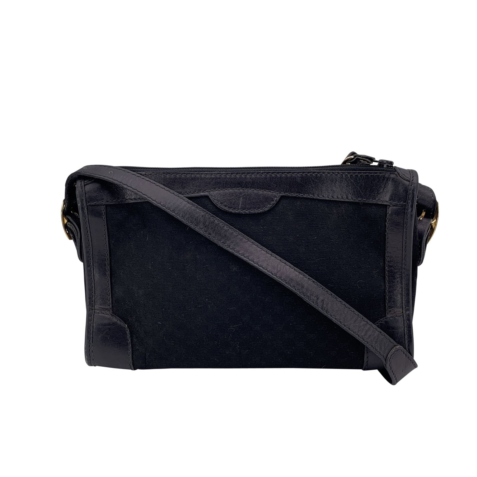 GUCCI VINTAGE CLOTH SHOULDER BAG: A true relic of Gucci's 1980s elegance, this black micro GG monogram shoulder bag is a perfect blend of classic design and understated luxury. Crafted in Italy during the golden era of vintage Gucci, 
