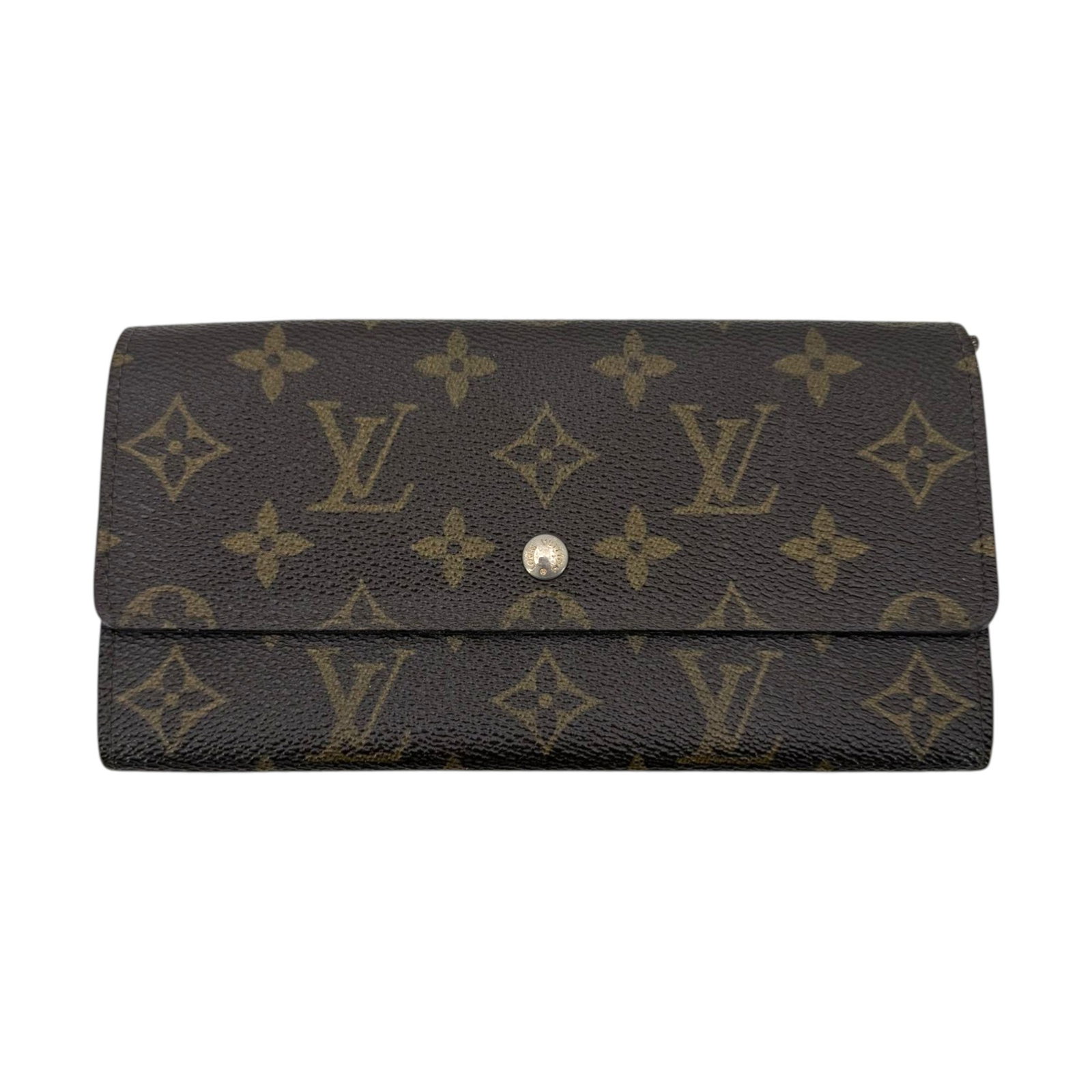 LOUIS VUITTON VINTAGE CLOTH WALLET SARAH: Step into the world of timeless elegance with this Louis Vuitton Sarah wallet, a classic piece of French craftsmanship from the 1980s. This medium-sized accessory is crafted from the brand's iconic