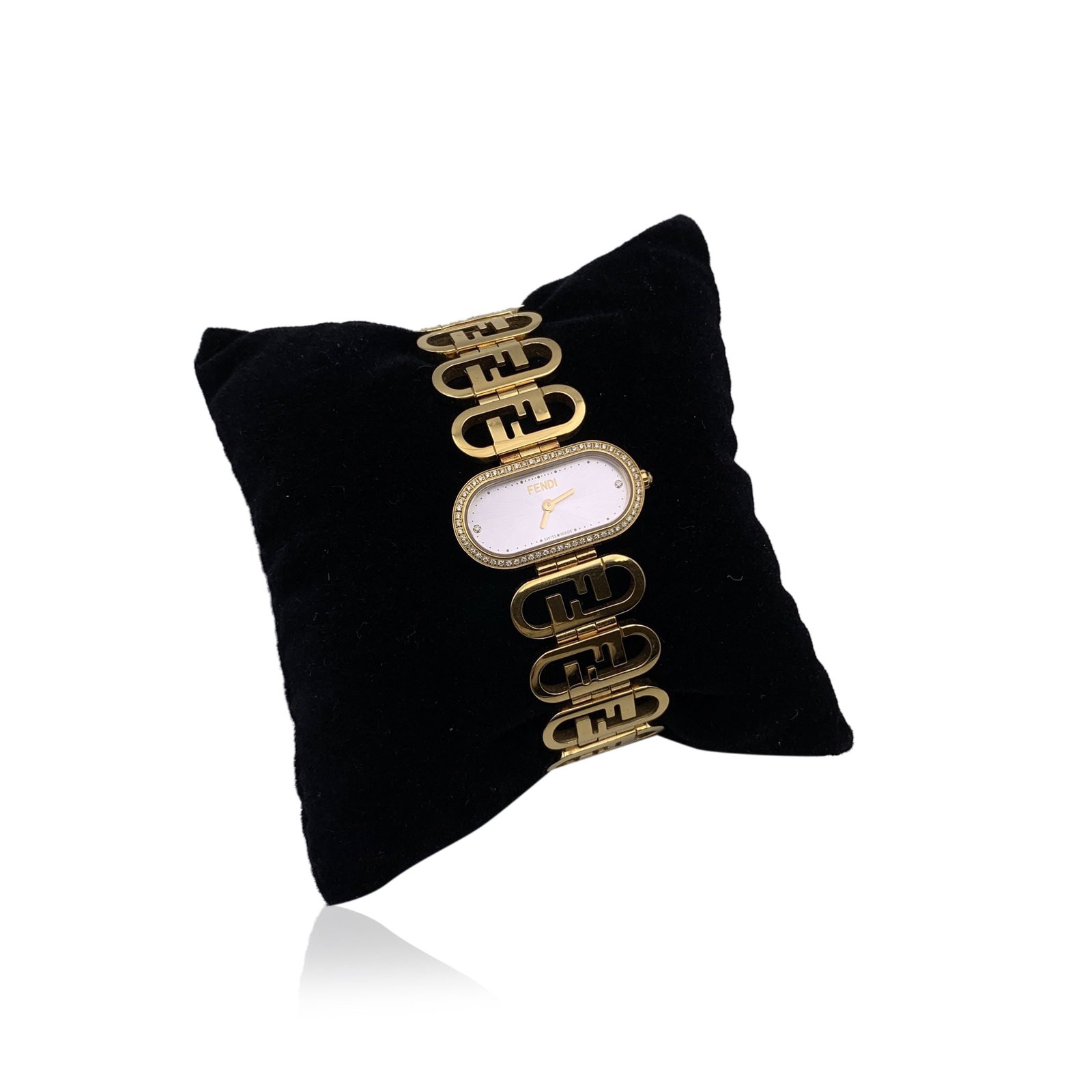 FENDI GOLD PLATED WATCH O'LOCK: Fendi gold plated stainless steel 'O'Lock Horizontal' wrist watch. Quartz movement. White dial and oval bezel set with 62 diamonds totaling approx. 0.17ct. Oval chain bracelet with FF logo. Butterfly 