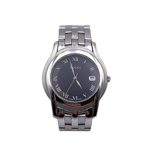 GUCCI STEEL WATCH G-TIMELESS: Step into the early 2000s with this G-Timeless Gucci watch, a perfect blend of Swiss precision and iconic Italian luxury. This medium-sized unisex timepiece features a polished silver-tone steel case 
