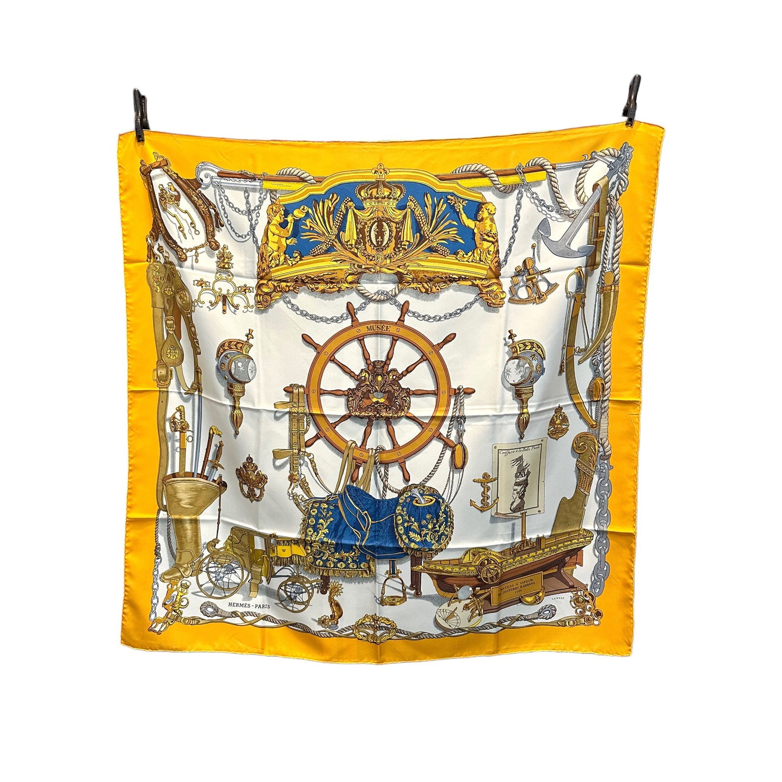 HERMES VINTAGE SILK SCARF CARRE 90: Experience the timeless elegance of the Hermes Carre 90, a masterpiece of French silk craftsmanship dating back to the 1960s. This stunning yellow scarf showcases the legendary Musee design by Philipp