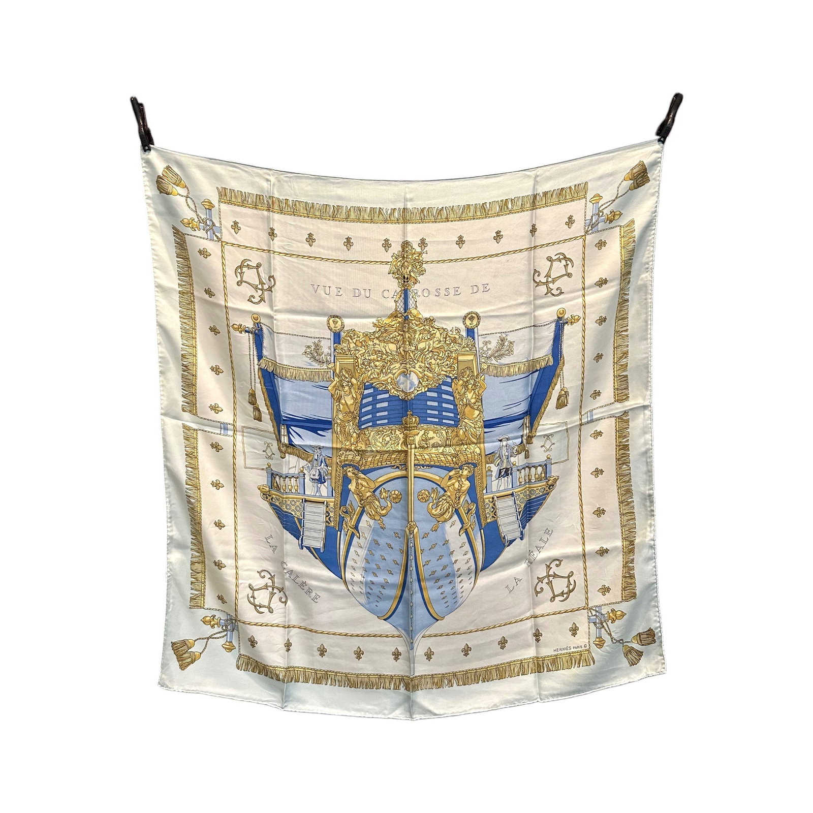 HERMES VINTAGE SILK SCARF CARRE 90: Step into the golden age of French elegance with the iconic Hermes Carre 90, a vintage treasure that showcases the mastery of designer Hugo Grygkar. This stunning silk scarf, titled La Reale - Vue du 