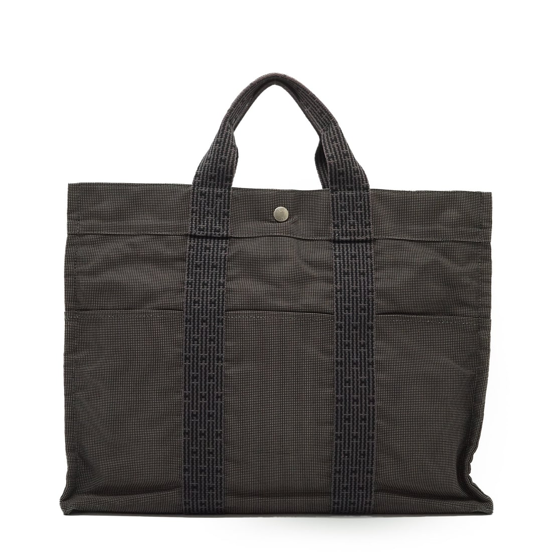 HERMES CLOTH TOTE BAG HERLINE: Step into vintage elegance with this Hermes Herline MM Yale Tote Bag, a quintessential piece from the 2000-2009 era. Meticulously crafted in France, this medium-sized tote is made from durable grey ca