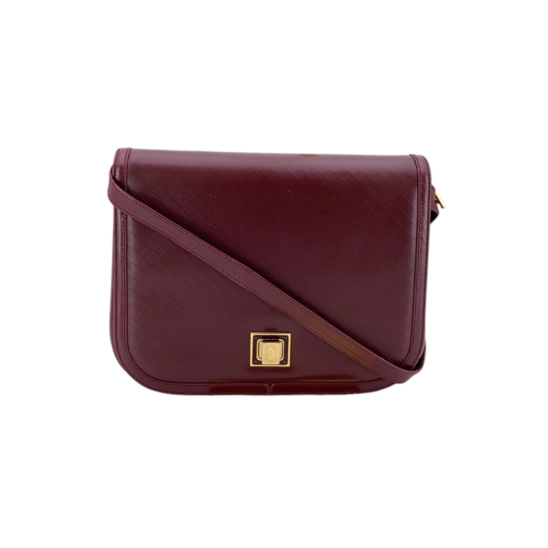 GUCCI VINTAGE LEATHER CROSSBODY BAG MICRO GG: Elevate your collection with this Gucci Vintage Structured Flap Messenger Bag, a sophisticated piece from the 1980s. Crafted in Italy from premium burgundy leather, this medium-sized crossbody bag fea