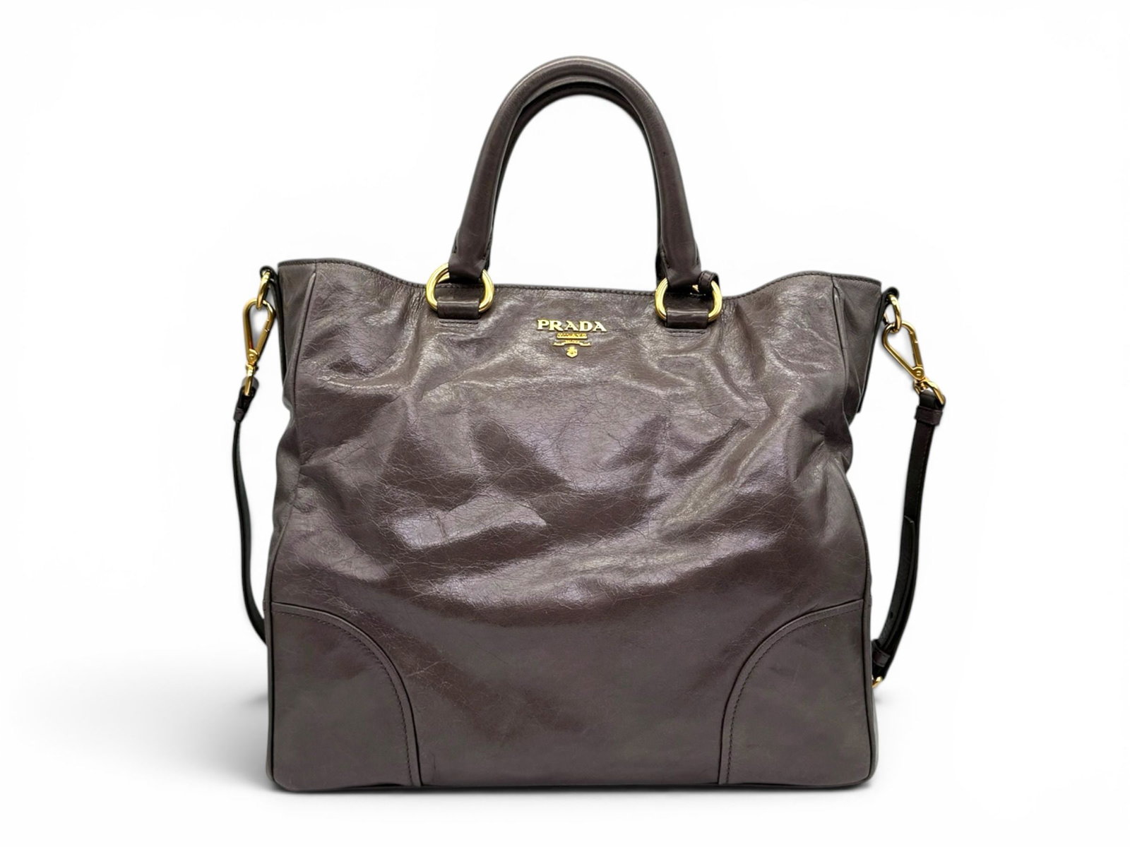 Prada Shopper Shine Calfskin Shoulder Bag, Spacious and Sophisticated Design: This Prada Shopper bag is crafted in luxurious shine calfskin leather, offering a perfect blend of elegance and practicality. Its refined smoke gray color and spacious silhouette make it an ideal comp