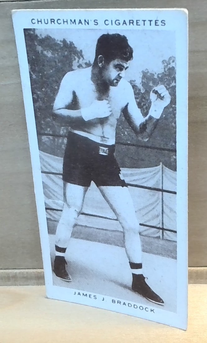 1938 Original Boxing Personalities Tobacco card James Braddock #6 VG-VG+: Part of the original 1938 Churchman Boxing Personalities Tobacco cards Series, , an unusual card great for grading ,or for collecting or reselling. Card comes in penny sleave and hard plastic top load