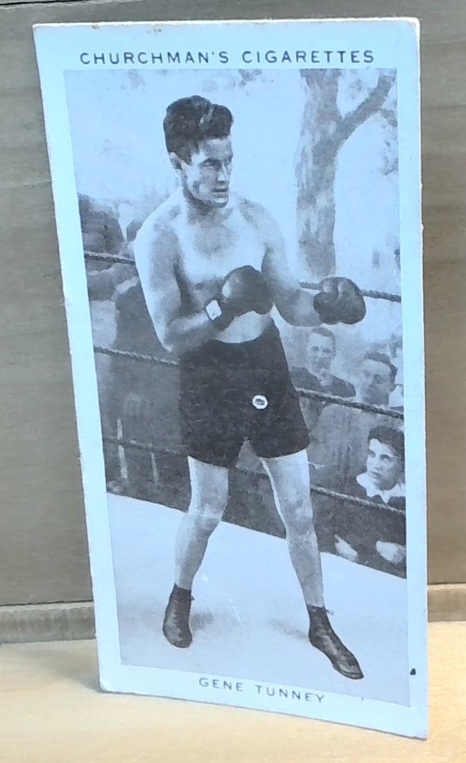 1938 Original Boxing Personalities Tobacco card Gene Tunney #33 VG-VG+: Part of the original 1938 Churchman Boxing Personalities Tobacco cards Series, , an unusual card great for grading ,or for collecting or reselling. Card comes in penny sleave and hard plastic top load