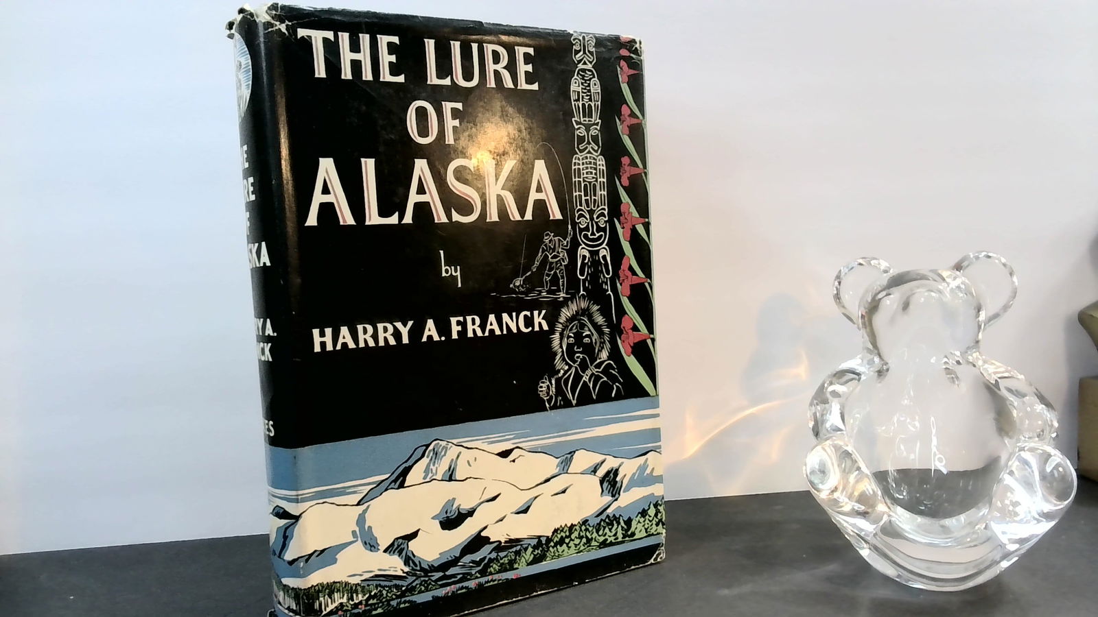 The Lure of Alaska by Harry A Franck illustrated in jacket travel 1st stated: Published by Stokes, in jacket, with a little bit of blemish to rear board cloth and rear jacket flap, but fairly thick hardcover, original cloth, illustrated. with some blemish, 1st, edge wear, limit