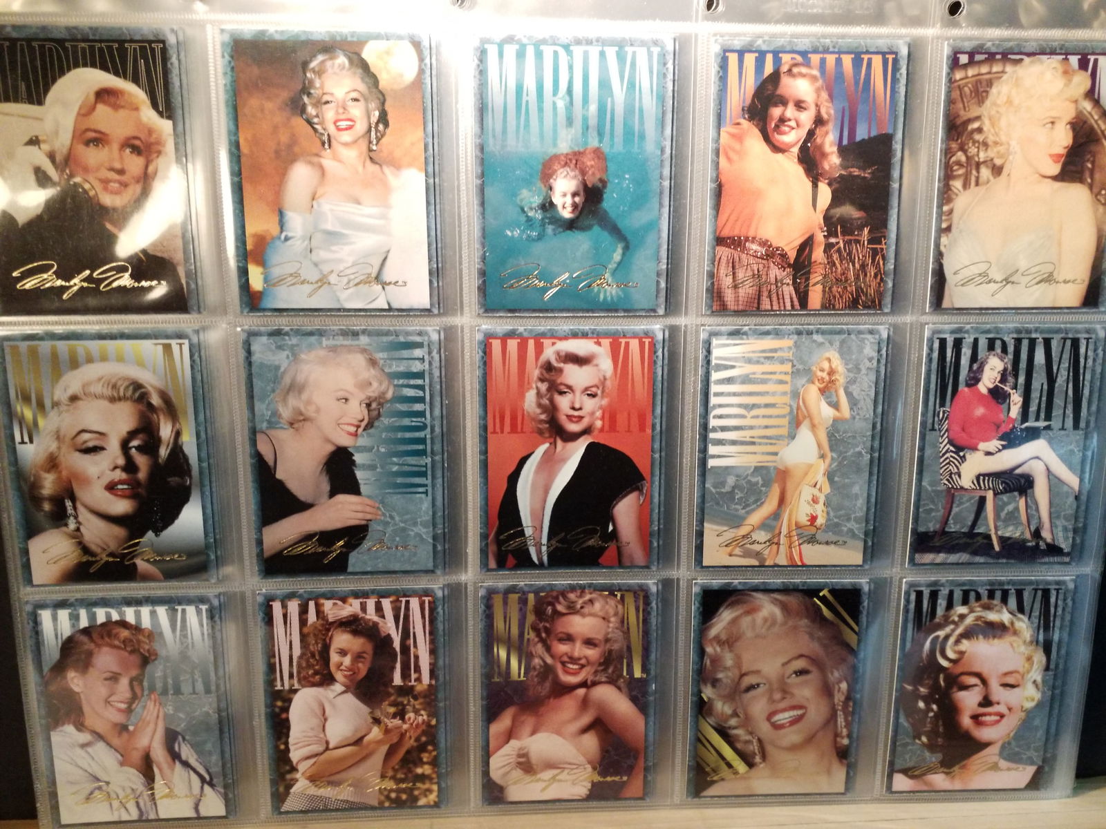 A Massive Collection of 135 Marilyn Monroe Cards 2 different collections: Published by Sports Time cards, possilbe set unchecked, A beautiful sheeted collection of Marilyn Monroe cards, Mint, 135 cards