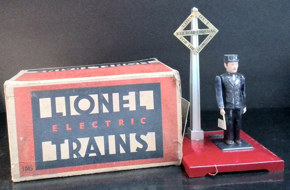 Antique Beautiful Lionel Railroad Flag man with Metal R/R Crossing sign in box no.1045: Postwar Lionel O 027 No. 1045 Operating Flagman w/ Box, in exceptional condition with just virtually no wear, and if it was used it wasnt very much and is well preserved with original box.