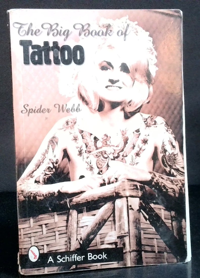 Big Book of Tattoo by Spider Webb 1st edition, packed with full page Pictures of Tattoos: Published by Schiffer large thick softcover, every page with hightly detailed pictures of Tattoos. Rare volume, This volume is beginning to fall apart but still intact the thick quality pages are doin
