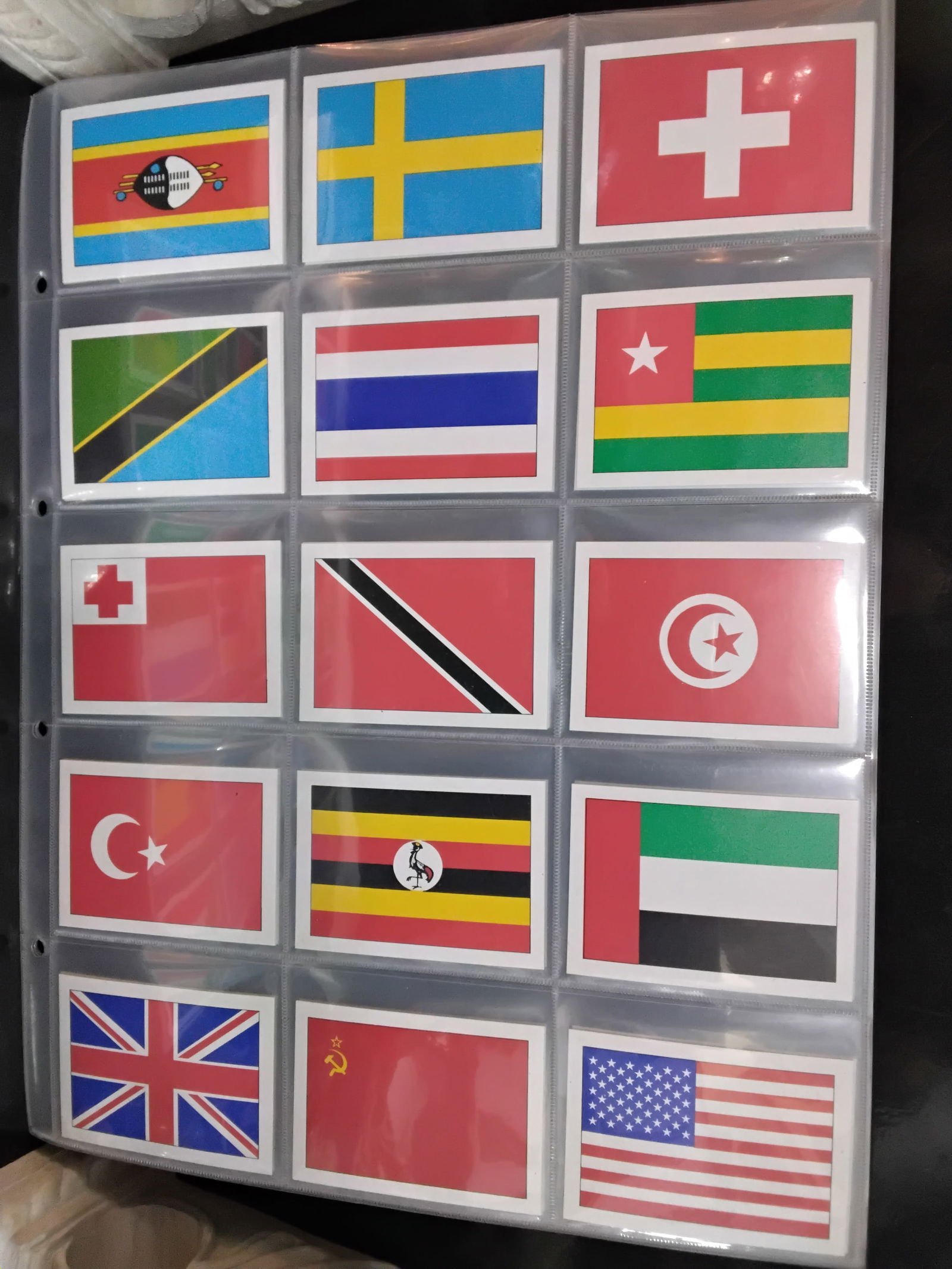 A large part set of Flags of the World Series Distributed by F&M Dobson 75 Cards US Flag: Sheeted Run of 75 Different Flags of a 144 cards set. This a run From # 61 - 135 , a very nice collection well worth completing the set. In very good condition, Please view pictures below