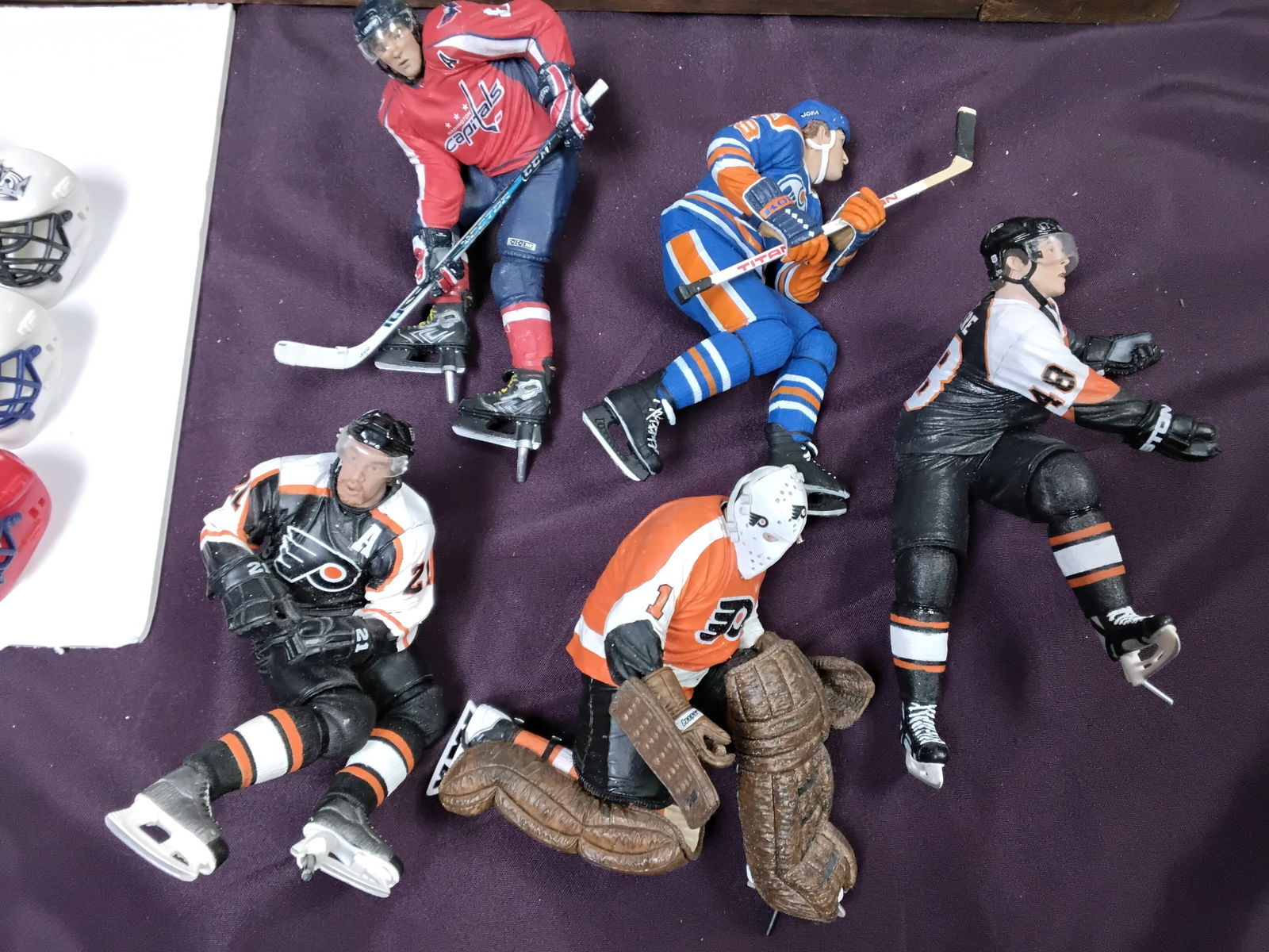 A Large table lot of Sports Hockey Memorabilia items: Mostly Hockey items, including NHL Franklin Mini Goalie Helmet Standings Board Complete Set of 30 Vintage , also included a very attractive Philadelphia Flyers Wooden Plaque, also high quality standin
