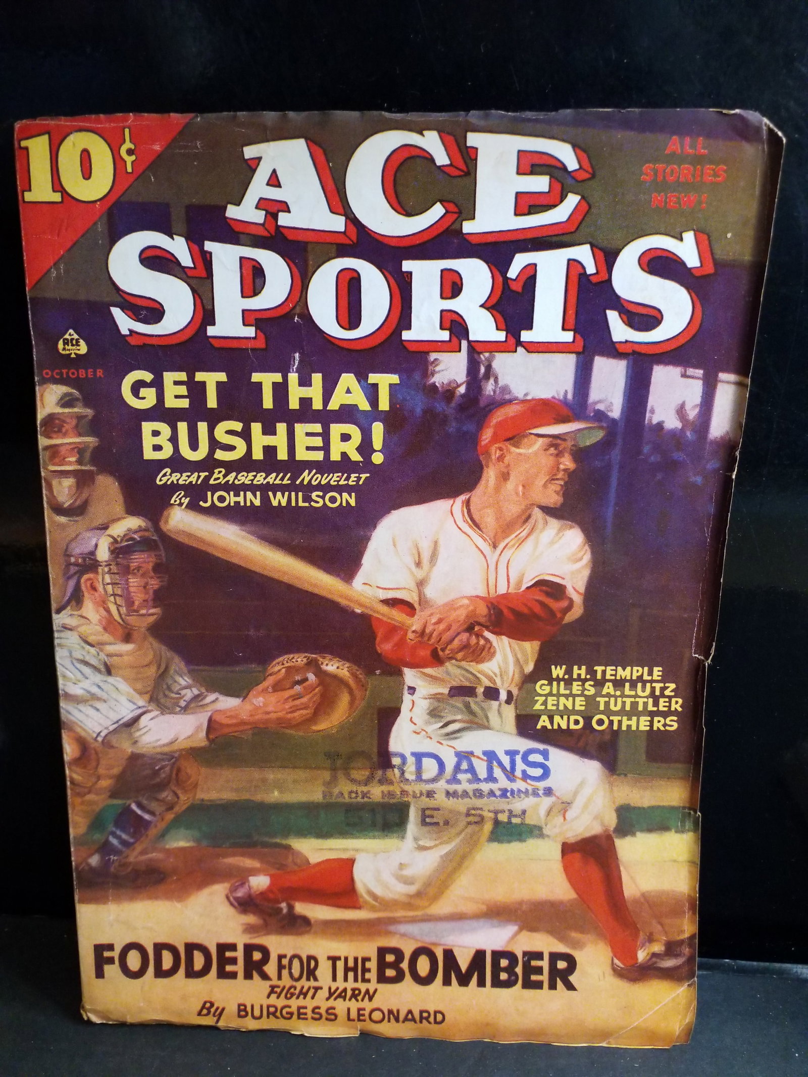 Ace Sports pulp magazine from the October 1941 issue Fodder for the Bomber by Burgess Leonard VG+: Featured Stories:"Get That Busher!" – A baseball novelette by John Wilson."Fodder for the Bomber" – A boxing/fight yarn by Burgess Leonard.Contributing Authors: Features sports fiction from W.H. T