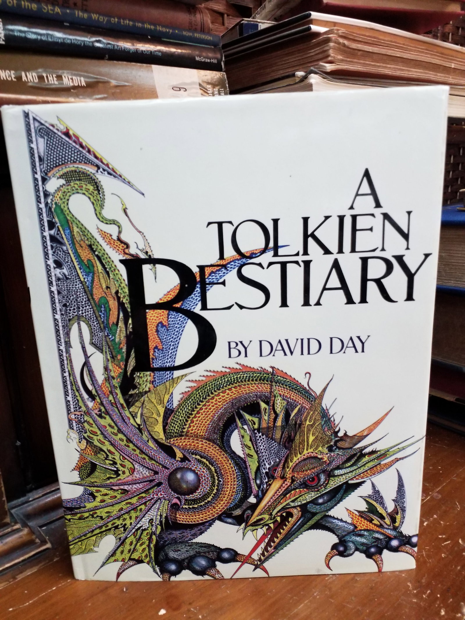A Tolkien Bestiary by David Day Fantastical Illustrations Middle Earth the Hobbit Lord of the Rings.: Published in 2001 by Random House, This is a hardcover edition of A Tolkien Bestiary by David Day, which explores the creatures and mythology of Middle-earth.The cover features intricate fantasy artwo
