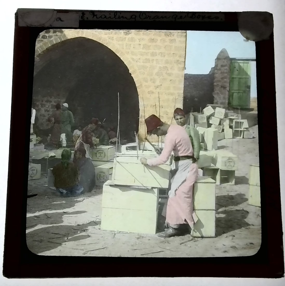 Nailing Orange boxes in the Holy Land 1880s-Early 1900s colored Magic Lantern Slide Identified (1 of 1)