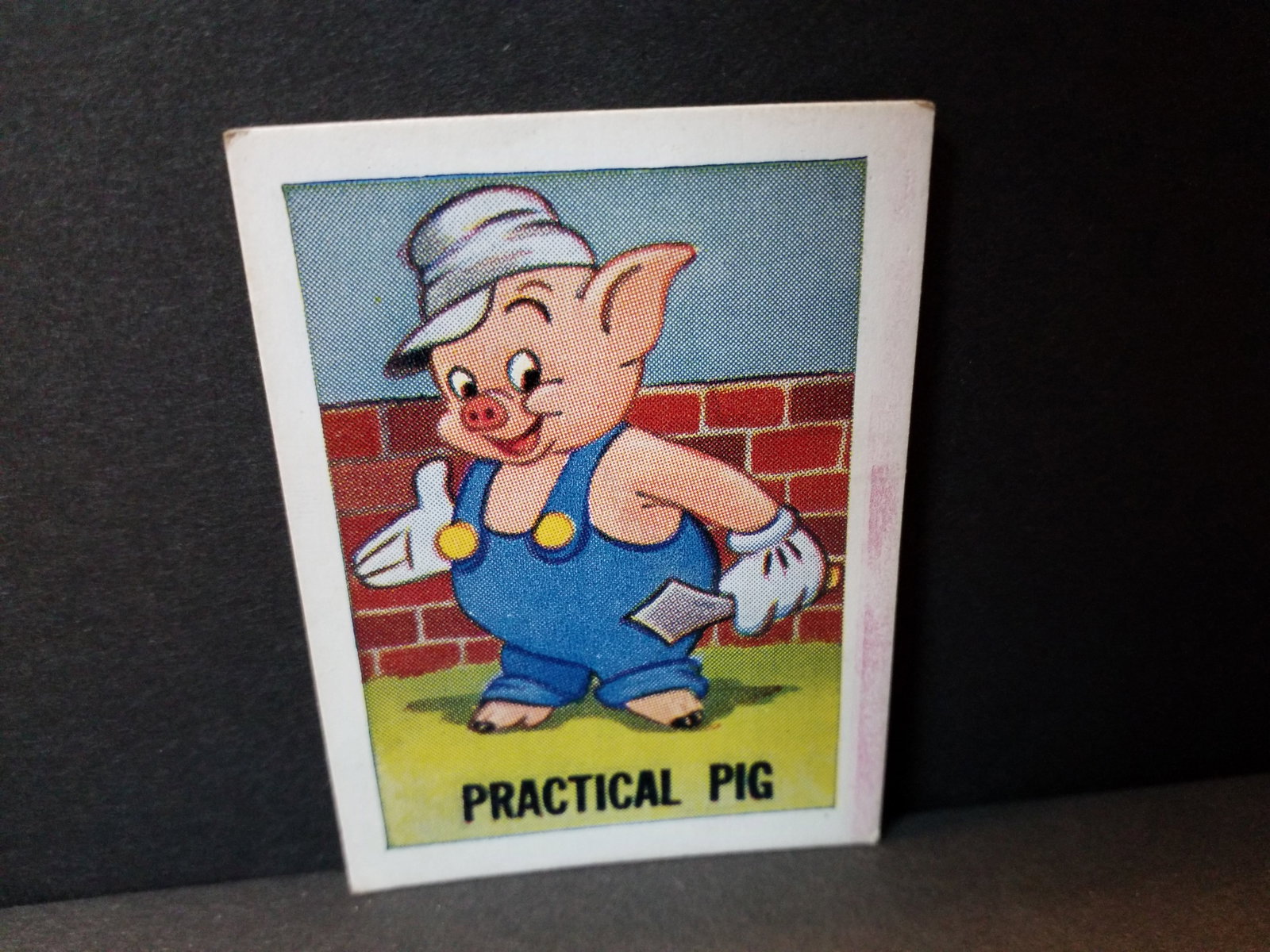 1955 Barratt Walt Disney Sweet Cigarettes Card Practical Pig of the Three little Pigs VG-VG+: Original Walt Disney Mickeys Sweet Cigarette card, Many original Tobacco and trade cards being added to this our current auction. Please continue to check back for recent arrivals.
