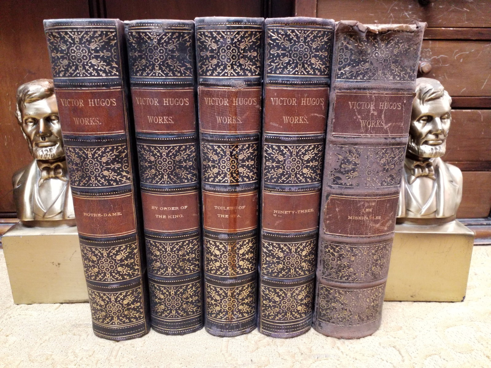 Victor Hugo 5 volume set 1889 Les Miserables Hunchback of Notre Dame Bindings: This collection was published by James Lyon NY. In 1889. Illustrated volumes, attractive, with some wear but overall these 1/4 leather vols are doing well , marble boards, The Victor Hugo 5-volume set