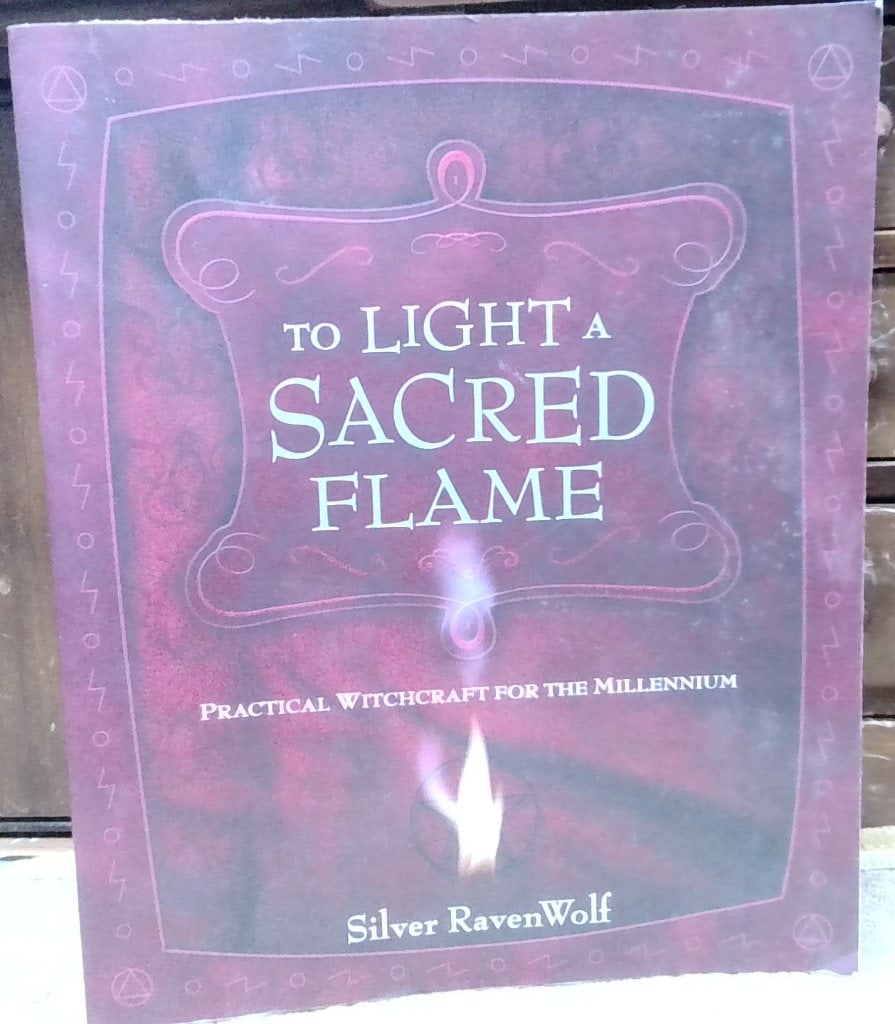 Silver RavenWolf To Light A Sacred Flame Book: Silver RavenWolf, To Light A Sacred Flame, Practical Witchcraft For The Millennium, Llewellyn Publications, 2008 Revised Edition, Trade Paperback.