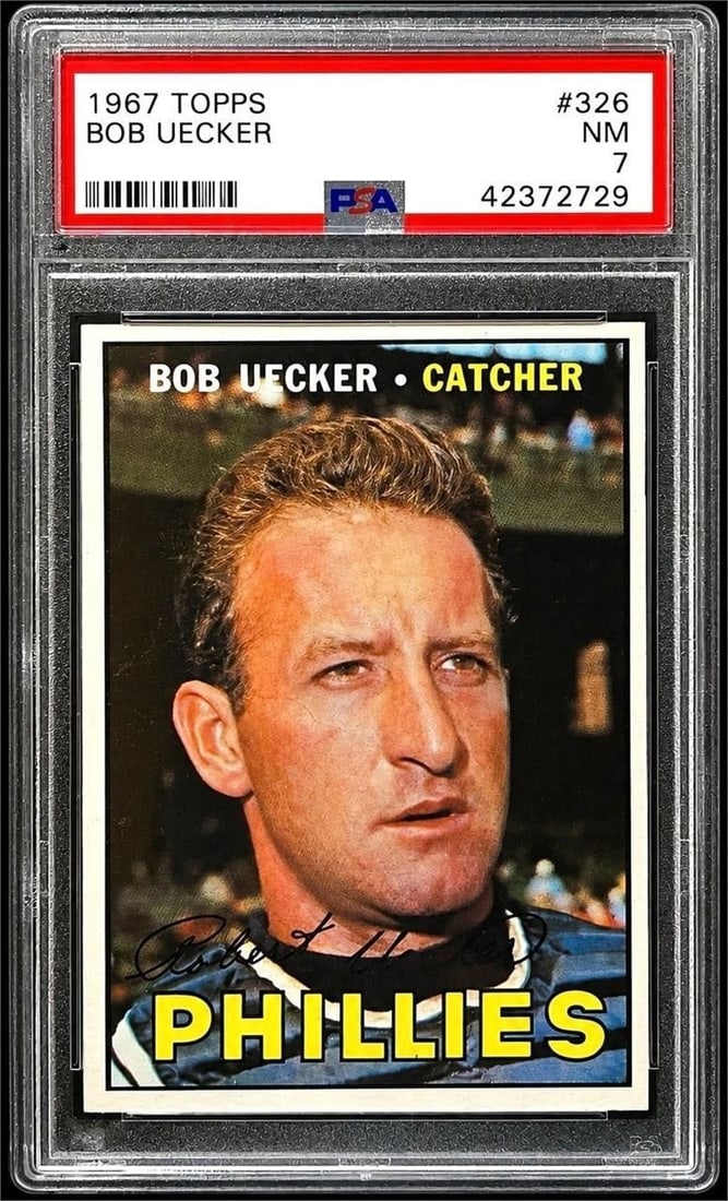 1967 Topps #326 Bob Uecker (PSA 7): 1967 Topps #326 Bob Uecker MLB Baseball Trading Card (PSA 7 NM) (PSA Certification: 42372729). Featuring one of the most beloved and entertaining personalities in baseball history during his playing c